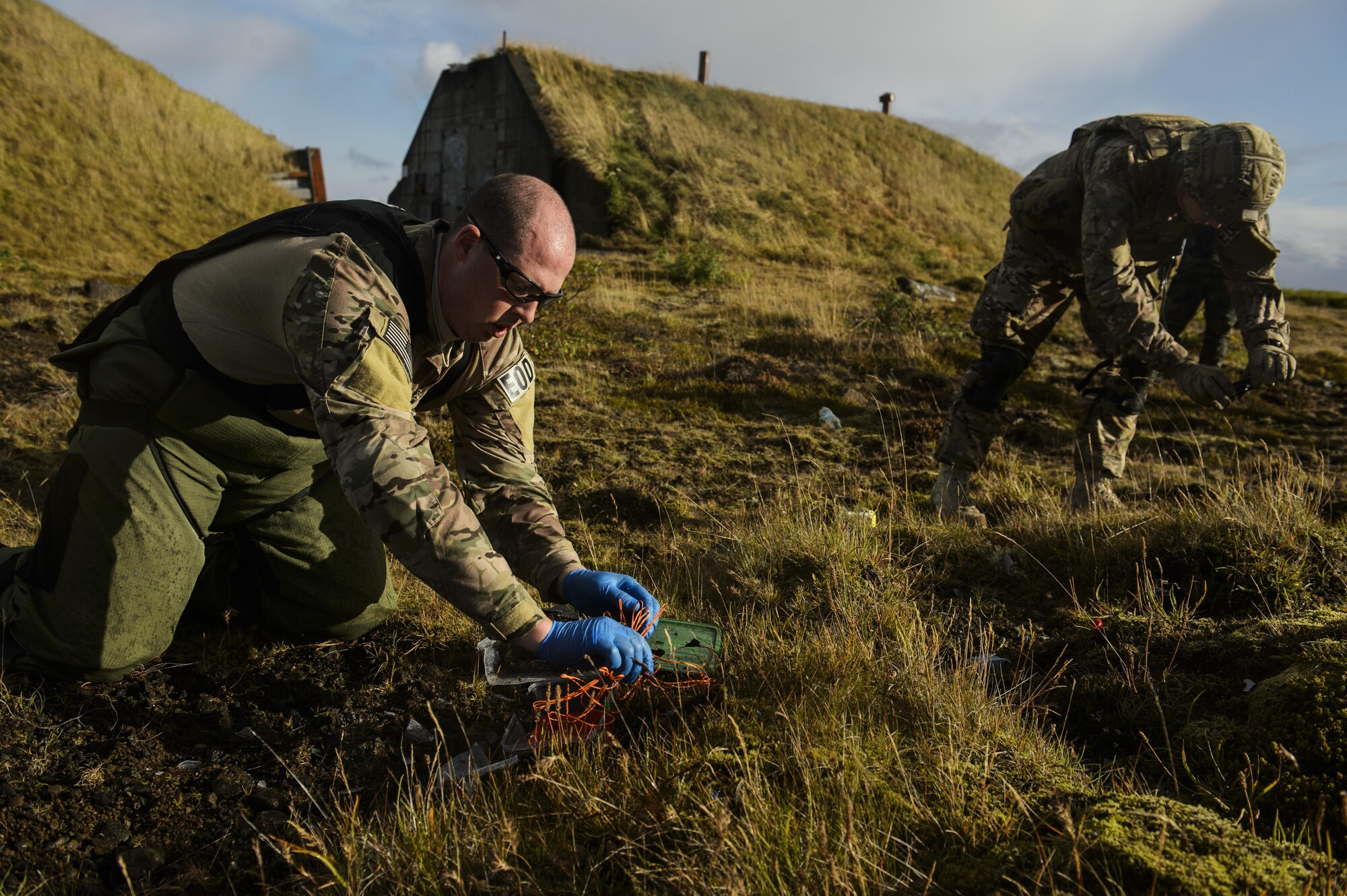 U.S. Air Force Tech. Sgt. Jason Umlauf, left, and Senior Airman Kyle Koski, 52nd Civil Engineer Squadron explosive ordnance disposal, Spangdahlem Air Base, Germany, collect evidence from a detonated improvised explosive devices during Northern Challenge 16 exercise at Icelandic Coast Guard Keflavik Facility, Iceland, Sept. 19, 2016. The exercise focused on disabling improvised explosive devices in support of counter-terrorism tactics to prepare Partnership for Peace, NATO, and Nordic nations for international deployments and defense against terrorism. (U.S. Air Force photo by Staff Sgt. Jonathan Snyder)