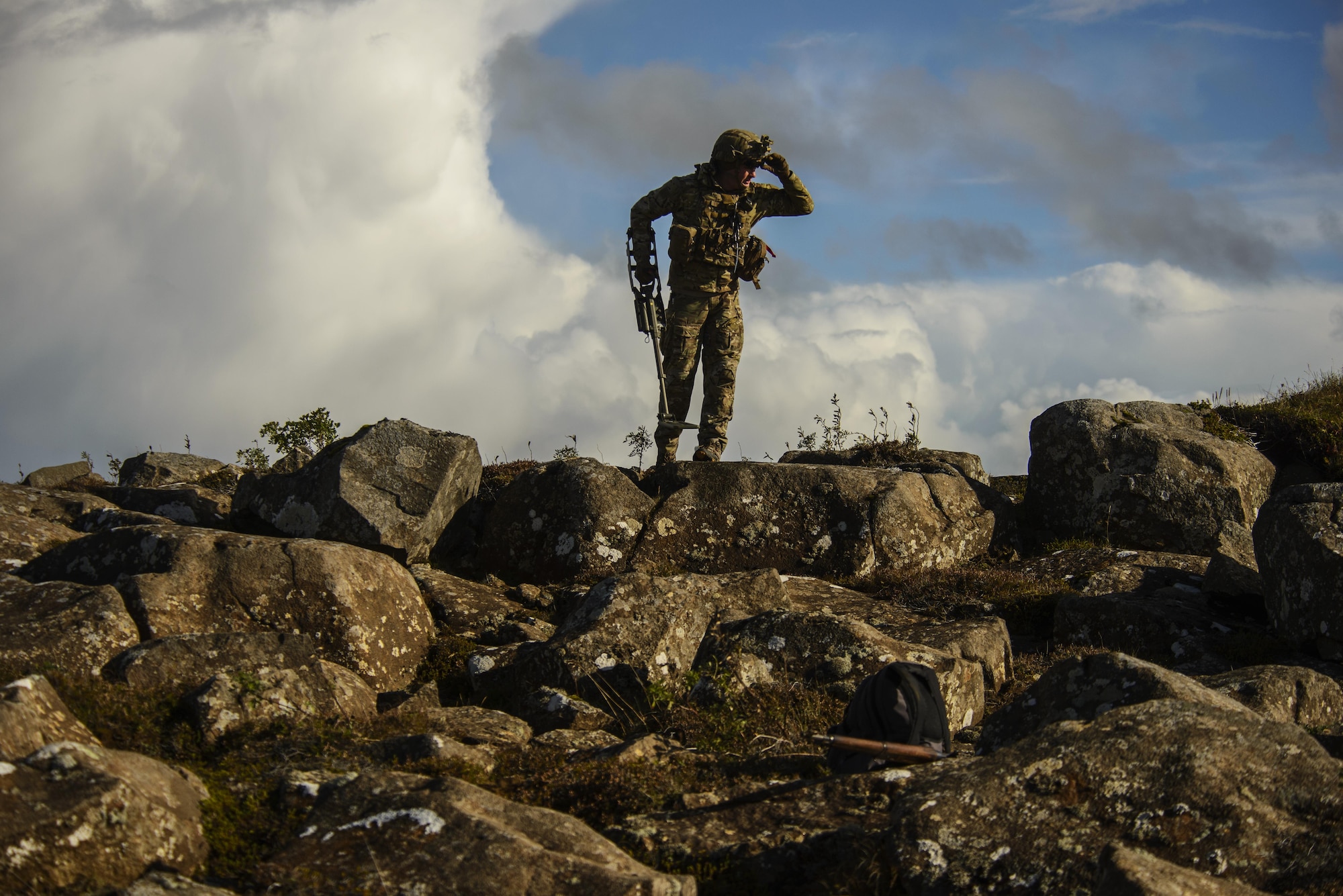 U.S. Air Force Staff Sgt. Cole Carroll, 52nd Civil Engineer Squadron explosive ordnance disposal craftsman, Spangdahlem Air Base, Germany, scans the area for additional threats after locating an improvised explosive device during Northern Challenge 16 exercise at Icelandic Coast Guard Keflavik Facility, Iceland, Sept. 19, 2016. The 52nd EOD, provides an operational explosive ordnance disposal capability to locate, identify, render safe, recover, field evaluate and dispose of all explosive ordnance. (U.S. Air Force photo by Staff Sgt. Jonathan Snyder)