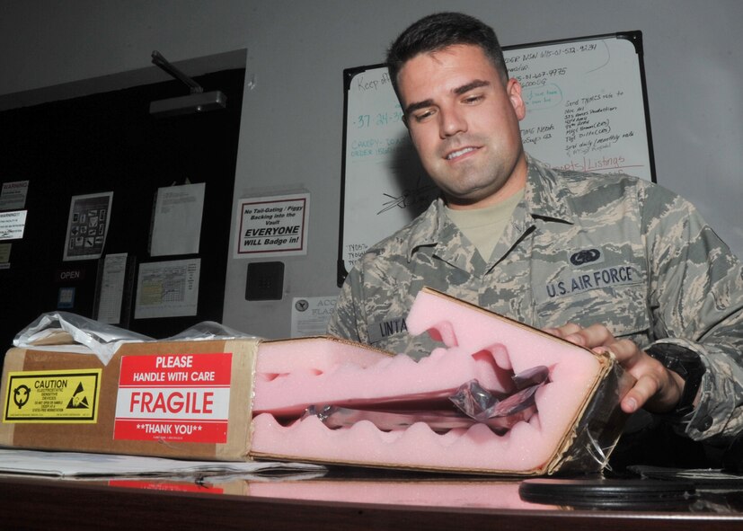 U.S. Air Force Senior Airman George Henry Lintala III, 325th Aircraft Maintenance Squadron supply journeyman, prepares to inspect an aircraft part for discrepancies at the 43rd Aircraft Munitions Unit on Tyndall AFB, Fla., Sept. 12, 2016. Lintala is a native of Sevilla, Spain where he spent the majority of his childhood. (U.S. Air Force photo by Senior Airman Ty-Rico Lea/Released)