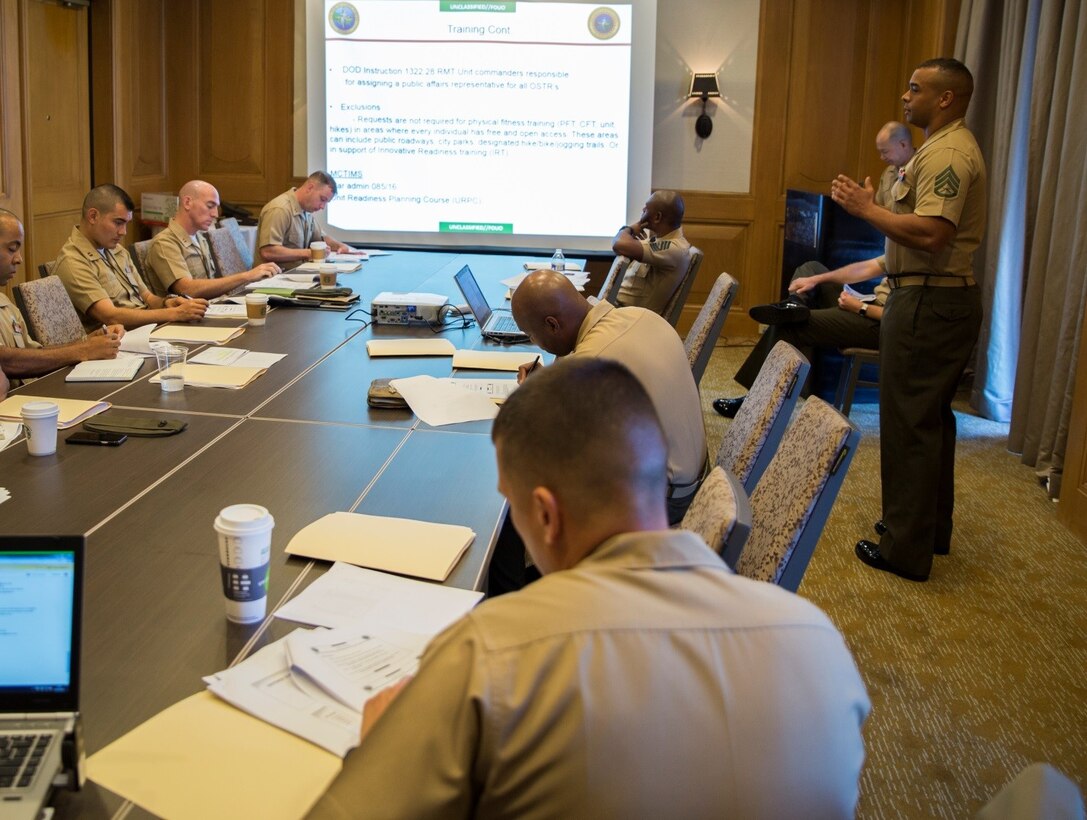 Staff Sgt. George C. Eberdt (right), operations assistant of 4th Marine Logistics Group, gives a presentation about the resources and services 4th MLG has available to Marines during the 2016 Inspector-Instructor Conference here, Sept. 20, 2016. I&I Marines gathered at the conference to share innovative ideas, as well as gain information on ways to improve their operations. (U.S. Marine Corps photo by Cpl. Melissa Martens/ Released) 