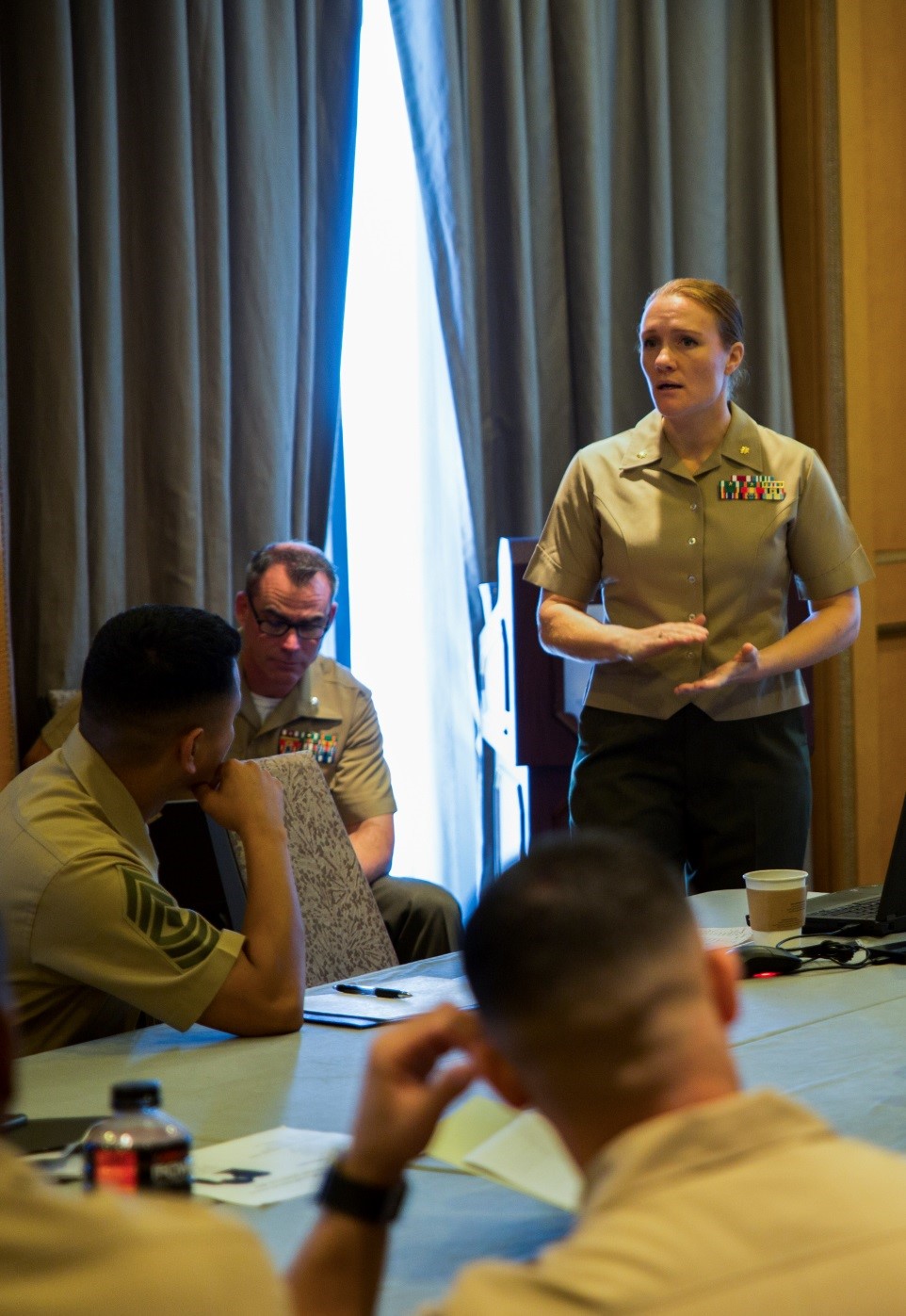 Maj. Katherine L. Schultz, communication operations officer for 4th Marine Division, presents on the types of support 4th MarDiv can offer to Inspector-Instructor Marines during the 2016 I&I Conference here, Sept. 20, 2016. I&I Marines gathered at the conference to share innovative ideas, as well as gain information on ways to improve their operations and what resources are available to them. (U.S. Marine Corps photo by Cpl. Melissa Martens)