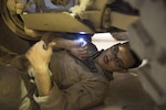 U.S. Marine Cpl. Ernesto VegaHernandez conducts a joint limited technical inspection of a recently refurbished Mine Resistant Ambush Protected vehicles, and the lighter version--MATV or MRAP All-Terrain Vehicle. The Kendall, Fla. native was a part of a select group of mechanics and communications maintainers with Combat Logistics Battalion 5, Special Purpose Marine Air Ground Task Force – Crisis Response – Central Command tasked with ensuring the vehicles were ready to be shipped to Iraq, where Marines are supporting Iraqi Security Forces in the fight against the Islamic State of Iraq and the Levant. SPMAGTF – CR – CC is a self-sustaining expeditionary unit, designed to provide a broad range of crisis response capabilities throughout the Central Command area of responsibility, using organic aviation, logistical, and ground combat assets. (Photo by SSgt. Lynn Kinney/ Released)