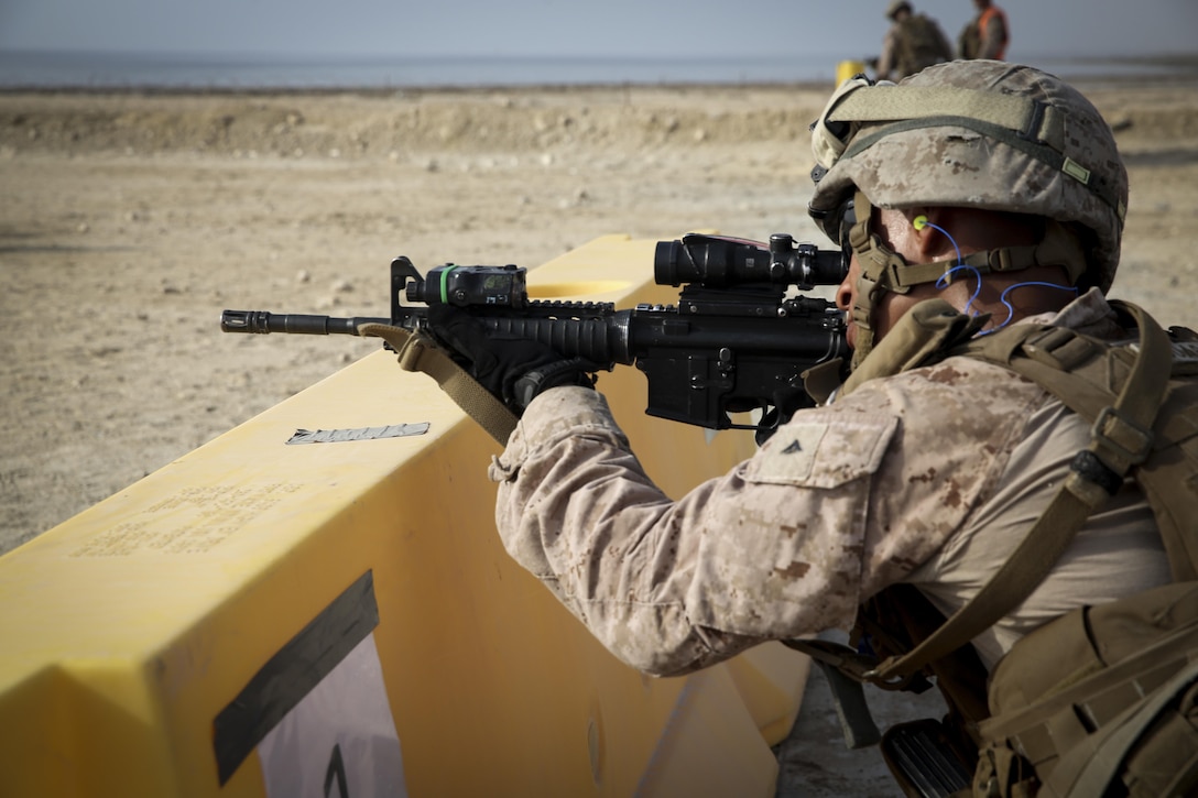 A Marine with Security Forces Company, Marine Wing Support Squadron-373, Special Purpose Marine Air Ground Task Force-Crisis Response-Central Command, sights in on his target during a live-fire and maneuver range while forward deployed, July 18, 2016. SPMAGTF – CR – CC is a self-sustaining expeditionary unit, designed to provide a broad range of crisis response capabilities throughout the Central Command area of responsibility, using organic aviation, logistical, and ground combat assets. (Photo by Cpl. Danielle Rodrigues/ Released)