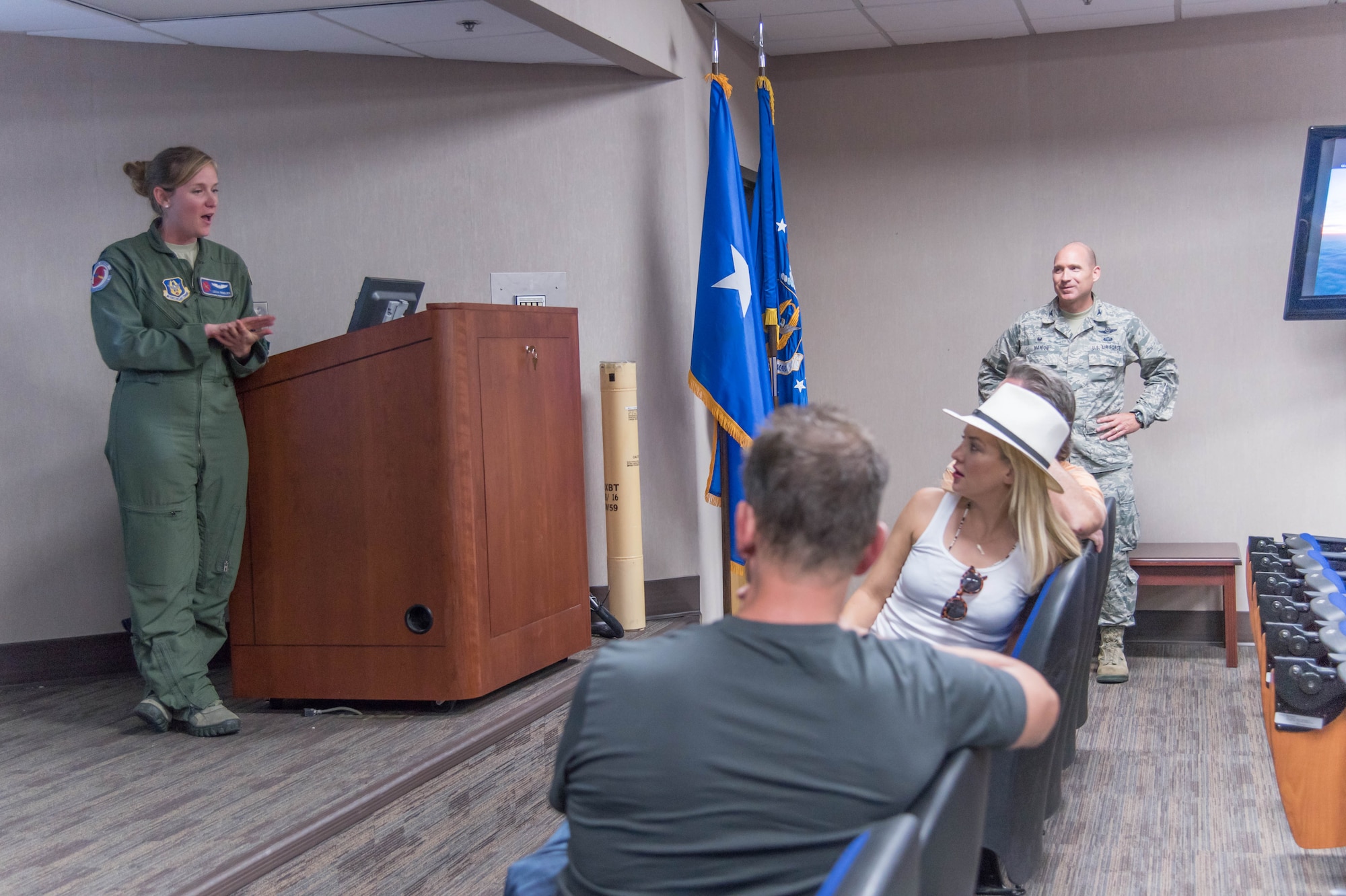 1st Lt. Leesa Froelich, 53rd Weather Reconnaissance Squadron areal reconnaissance weather officer explains the 53rd WRS mission to director Peter Berg and actors Kurt Russell and Kate Hudson. They visited Keesler Air Force Base Sept. 10 as part of a prescreening of their new film, Deepwater Horizon. (U.S. Air Force photo/Senior Airman Heather Heiney)