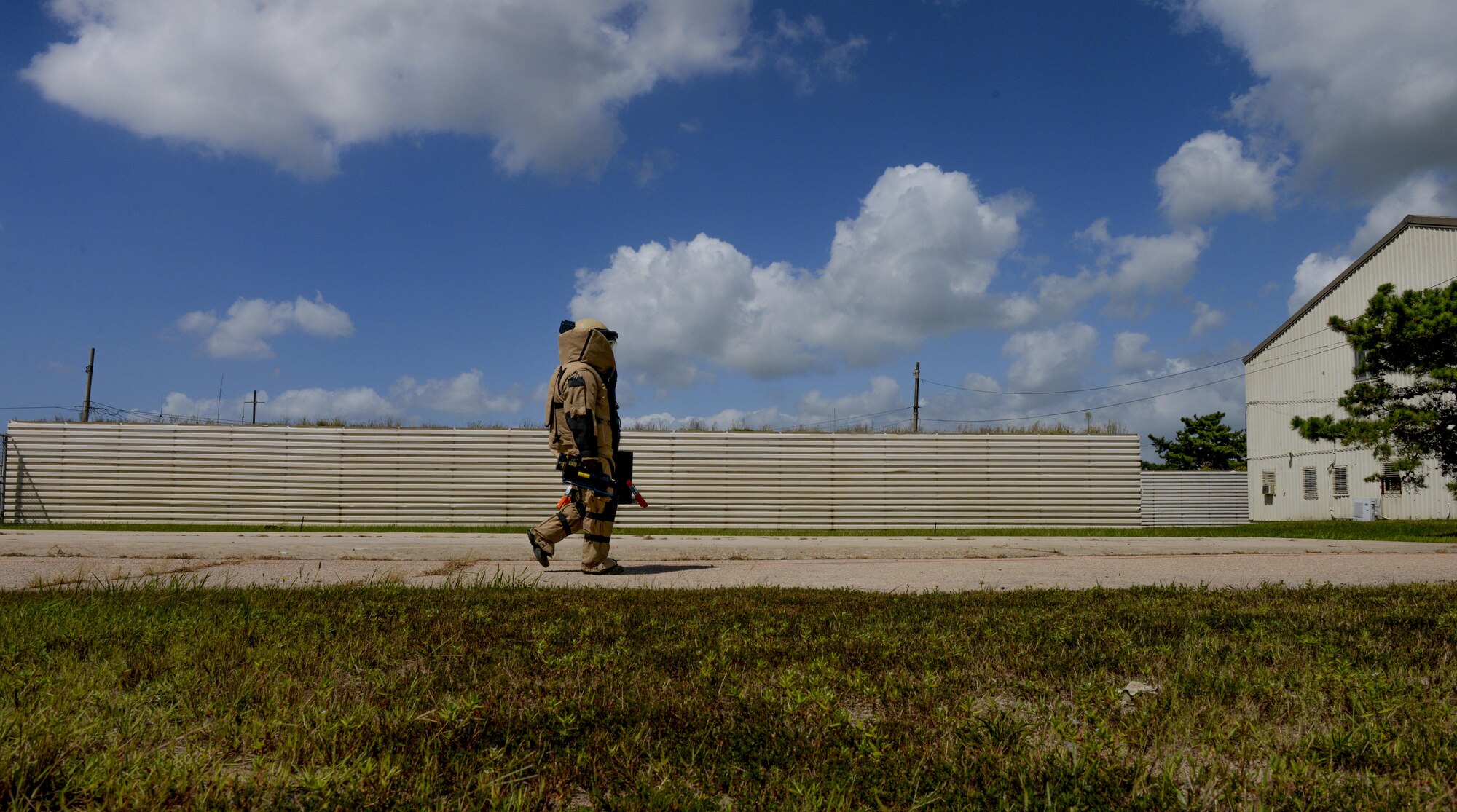 Staff Sgt. Shawn Hewitt, 8th Civil Engineer Squadron Explosive Ordnance Disposal technician, walks toward the area of a mock bomb during a training exercise at Kunsan Air Base, Republic of Korea, Aug. 30, 2016. The bomb suit contains heavy body armor made to stand the pressure caused by a bomb and any debris it produces. The suit is made to overlap all parts of the body for full protection. (U.S. Air Force photo by Senior Airman Colville McFee/Released)