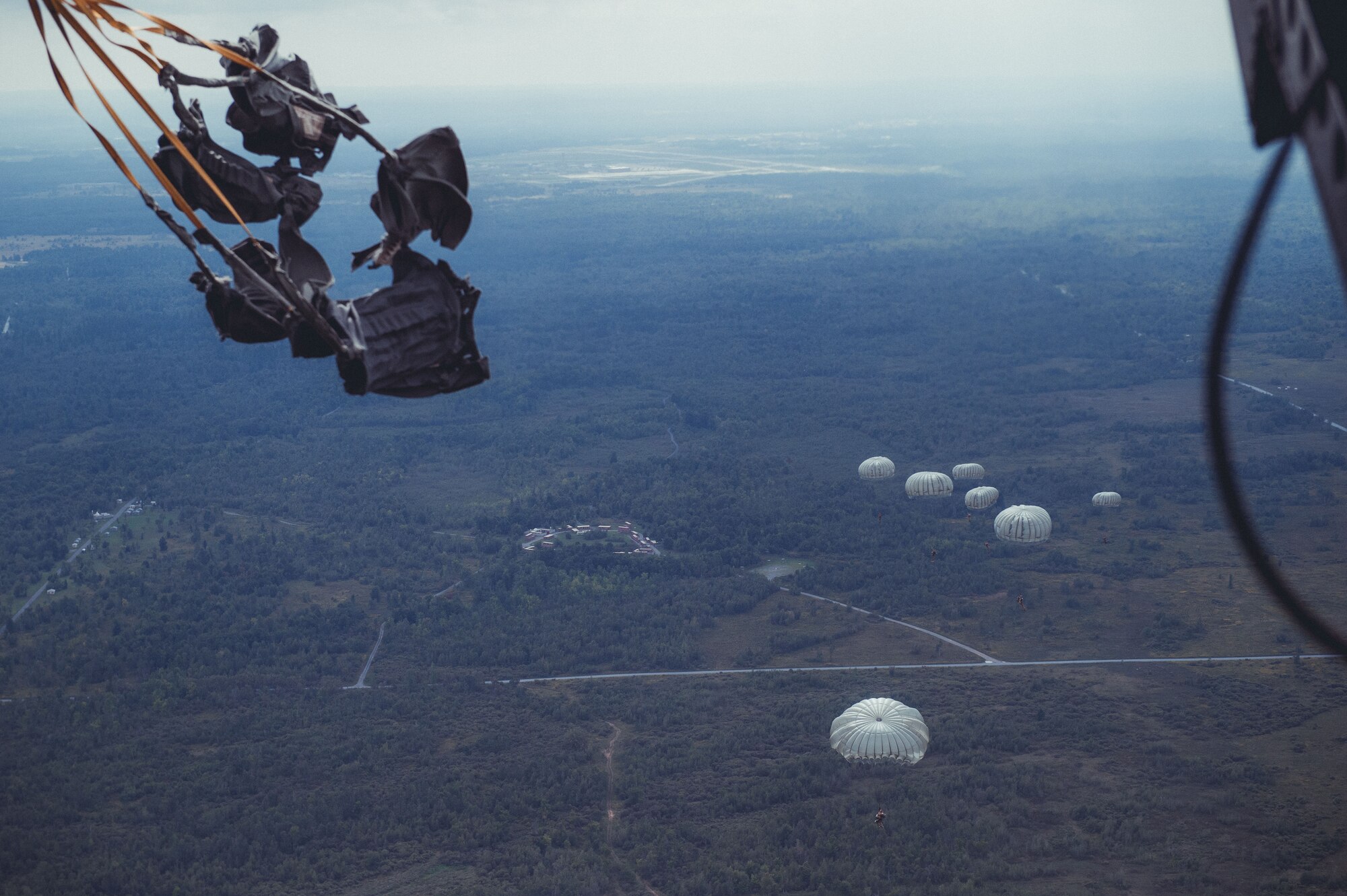 Airmen from the 274th Air Support Operations Squadron, Syracuse, N.Y., conduct air assault and parachute jump training out of a CH-47 Chinook helicopter from the 1-169th General Support Aviation Battalion, Rochester, N.Y., Sept. 10, 2016. The training is part of an annual requirement for parachute jumps, and a larger exercise involving the Civil Air Patrol acting as close air support. (U.S. Air Force photo by Staff Sgt. Ryan Campbell)