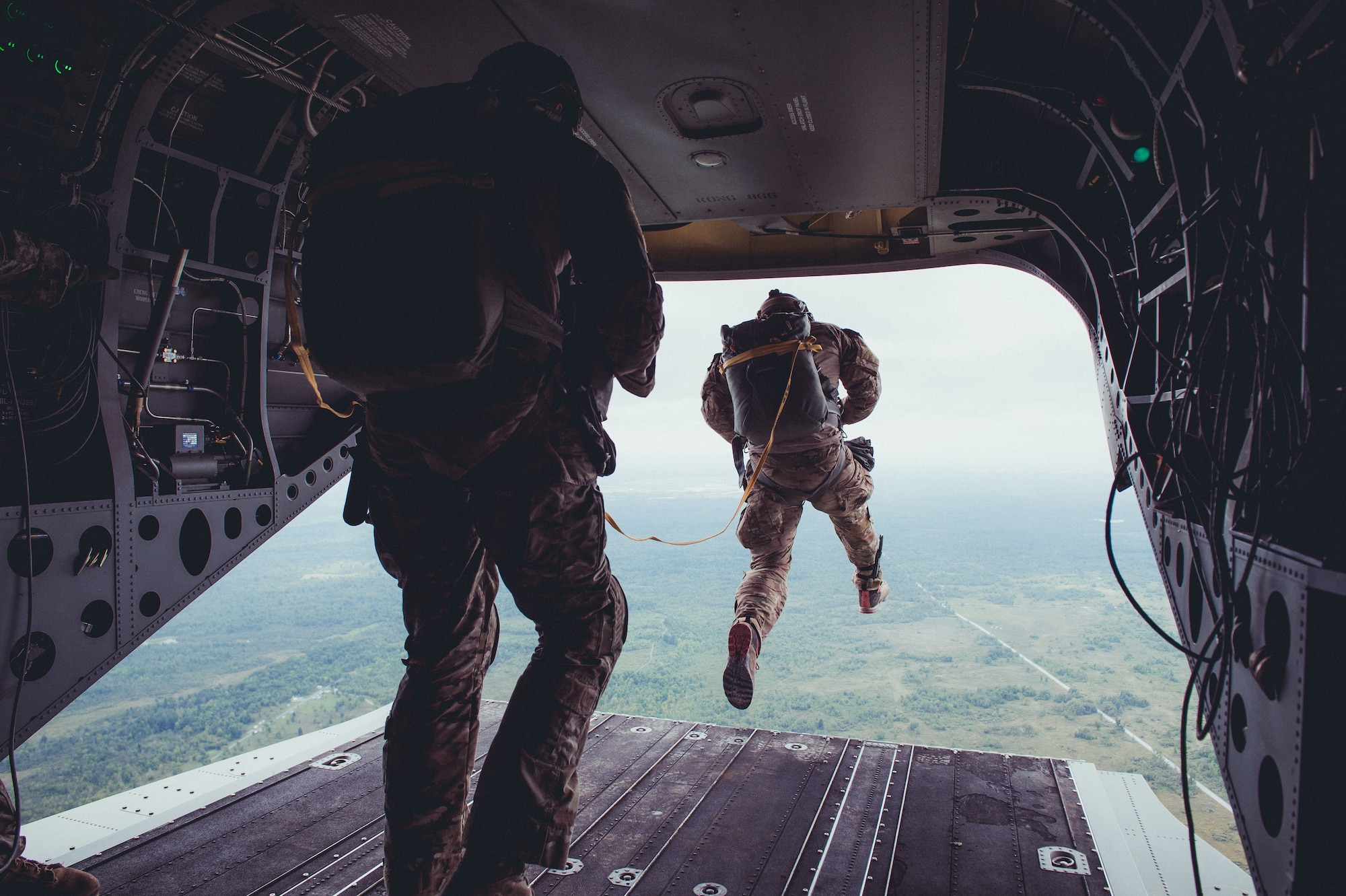 Airmen from the 274th Air Support Operations Squadron, Syracuse, N.Y., conduct air assault and parachute jump training out of a CH-47 Chinook helicopter from the 1-169th General Support Aviation Battalion, Rochester, N.Y., Sept. 10, 2016. The training is part of an annual requirement for parachute jumps, and a larger exercise involving the Civil Air Patrol acting as close air support. (U.S. Air Force photo by Staff Sgt. Ryan Campbell)