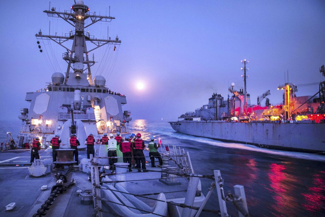 The guided-missile destroyer USS Stout prepares to receive fuel from the fast combat support ship USNS Arctic during a replenishment in the Persian Gulf, Sept. 16, 2016. The Stout is supporting maritime security operations and theater security cooperation efforts in the U.S. 5th Fleet area of operations. Navy photo by Petty Officer 3rd Class Bill Dodge