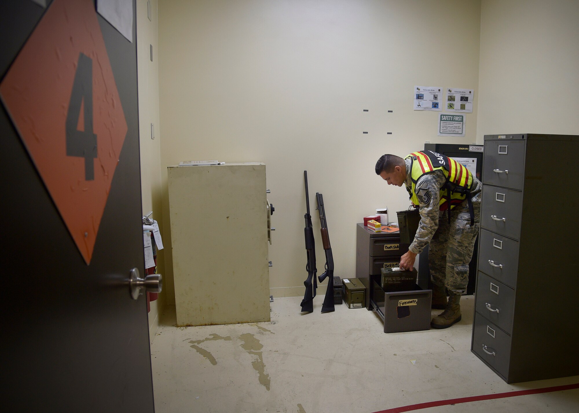 U.S. Air Force Master Sgt. Curtis Campbell, the bird aircraft strike coordinator with the 35th Fighter Wing, grabs ammunition before going to the flightline at Misawa Air Base, Japan, Sept. 15, 2016. Campell and his BASH team use an assortment of ammo, including cracker, birdshot and buckshot rounds, to scare or eliminate birds within the airspace. (U.S. Air Force photo by Senior Airman Deana Heitzman)
