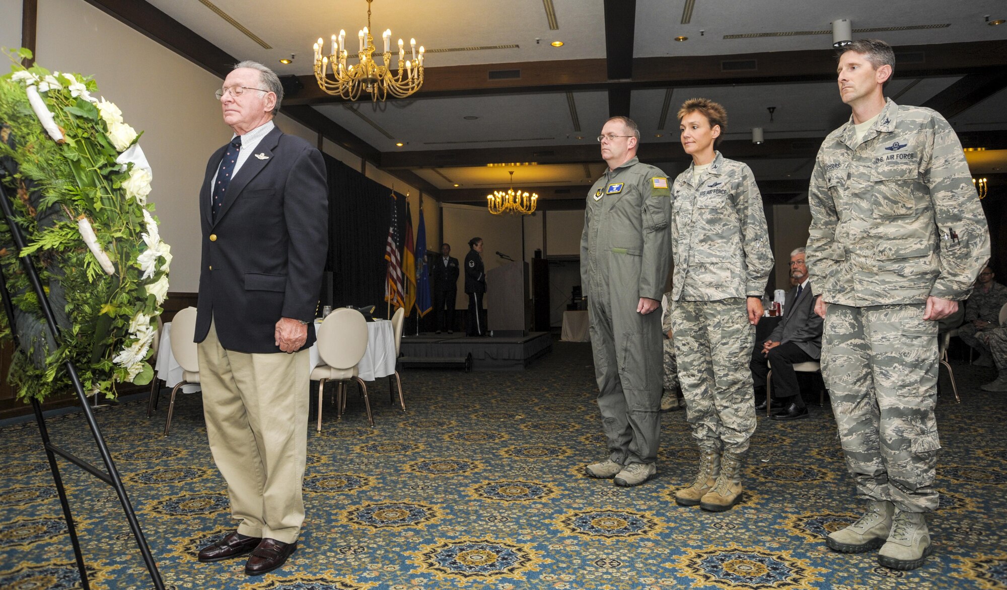 Retired U.S. Air Force Lt. Col. Melvin Pollack stands in silence before a wreath during a ceremony on National POW/MIA Recognition Day Sept. 16, 2016, at Ramstein Air Base, Germany. Pollack was joined by, from left, Brig. Gen. Richard G. Moore, Jr., 86th Airlift Wing commander, Col. Andra Kniep, 435th Air Ground Operations Wing and 435th Air Expeditionary Wing commander, and Col. Bradley Cooper, 521st Air Mobility Operations Wing vice commander, in laying the wreath. (U.S. Air Force photo/Staff Sgt. Timothy Moore)