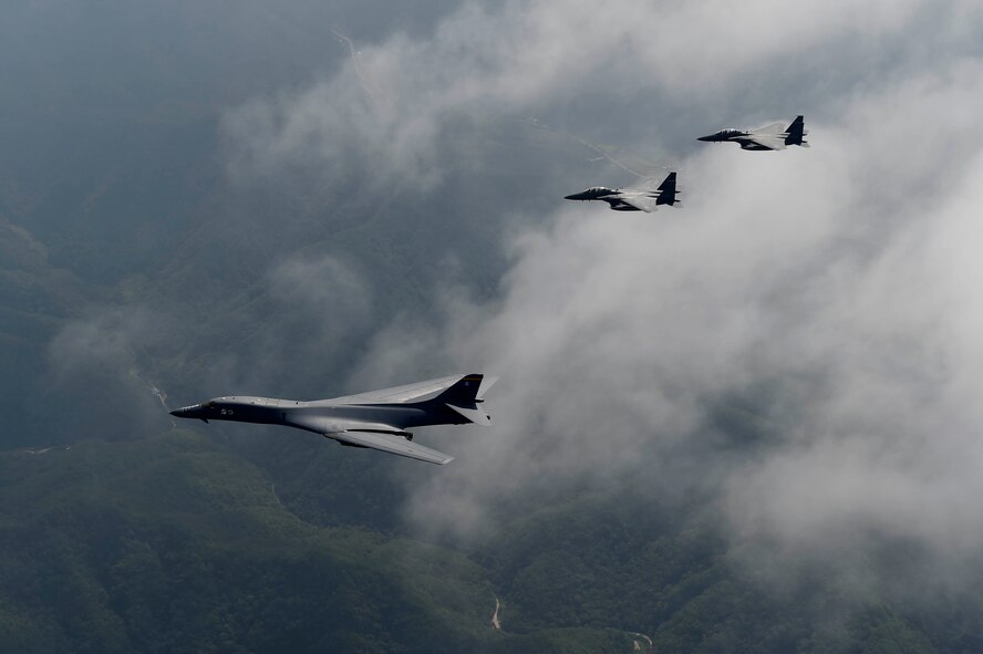 A U.S. Air Force B-1B Lancer deployed to Andersen Air Base, Guam, is flanked by two F-15K Slam Eagles assigned to Daegu Air Base, Republic of Korea, during flight over ROK skies Sept. 21, 2016. The flight was the closest a B-1 has ever flown to the border between the ROK and North Korea. The B-1 is the backbone of the U.S. long-range bomber mission and is capable of carrying the largest payload of both guided and unguided weapons in the Air Force inventory. (Republic of Korea air force photo by Chief Master Sgt. Kim, Kyeong Ryul)