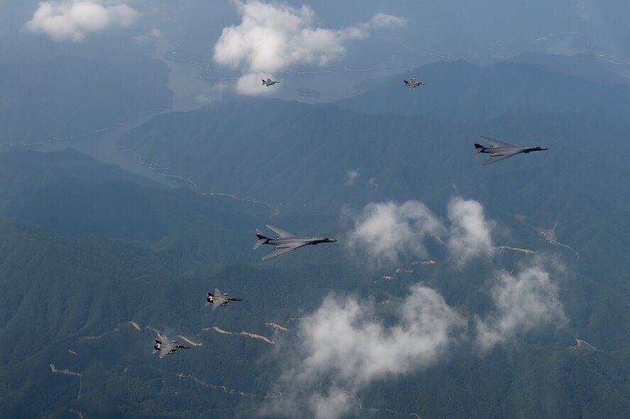 A formation of two B-1B Lancers deployed to Andersen Air Base, Guam, two F-15K Slam Eagles assigned to Daegu Air Base, Republic of Korea (ROK), and two F-16s assigned to Osan Air Base, ROK, fly over ROK skies. The flight was the closest a B-1 has ever flown to the border between the ROK and North Korea. The B-1 is the backbone of the U.S. long-range bomber mission and is capable of carrying the largest payload of both guided and unguided weapons in the Air Force inventory. (Republic of Korea air force photo by Chief Master Sgt. Kim, Kyeong Ryul)
