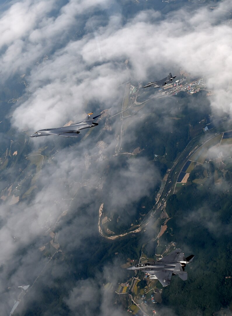 A U.S. Air Force B-1B Lancer deployed to Andersen Air Base, Guam, is flanked by two F-15K Slam Eagles assigned to Daegu Air Base, Republic of Korea, during flight over ROK skies Sept. 21, 2016. The flight was the closest a B-1 has ever flown to the border between the ROK and North Korea. The B-1 is the backbone of the U.S. long-range bomber mission and is capable of carrying the largest payload of both guided and unguided weapons in the Air Force inventory. (Republic of Korea air force photo by Chief Master Sgt. Kim, Kyeong Ryul)