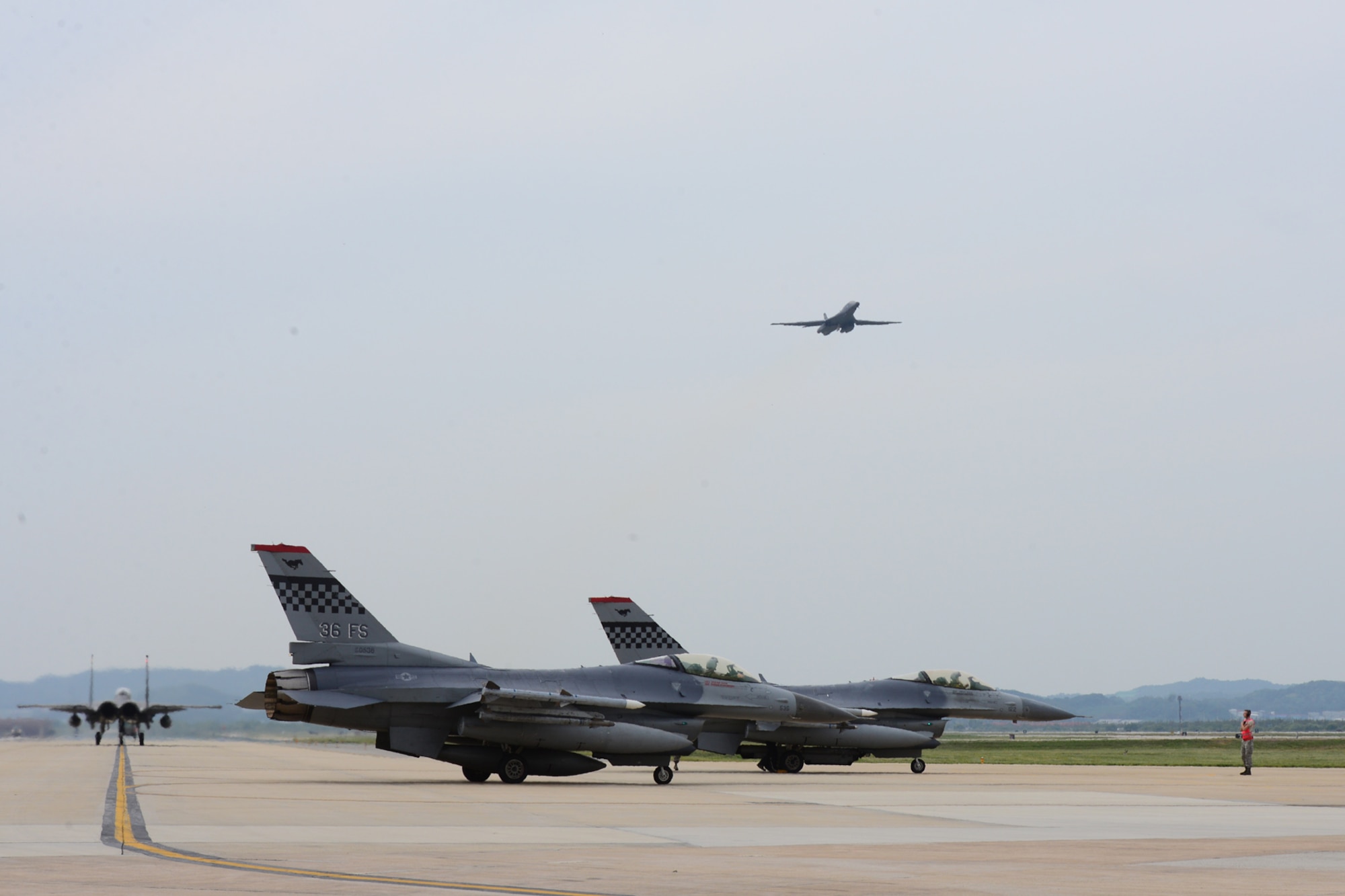 A U.S. Air Force B1-B Lancer deployed to Andersen Air Base, Guam, makes a low-level pass before landing at Osan Air Base, Republic of Korea, Sept. 21, 2016. The B-1 is the backbone of the U.S. long-range bomber mission and is capable of carrying the largest payload of both guided and unguided weapons in the Air Force inventory. The flight was the closest a B-1 has ever flown to the border between the Republic of Korea and North Korea. (U.S. Air Force photo by Staff Sgt. Rachelle Coleman)
