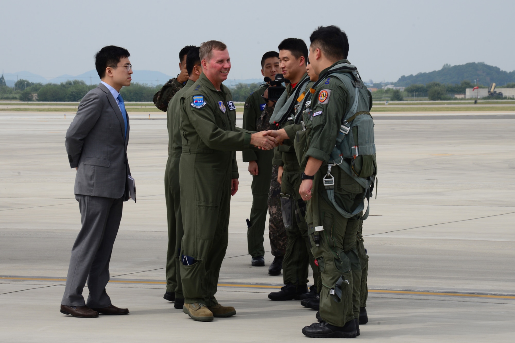 Republic of Korea F-15K Slam Eagle pilots are greeted by U.S. Air Force Lt. Gen. Thomas W. Bergeson, 7th Air Force Commander, following a landing of the B1-B Lancer at Osan Air Base, Republic of Korea, Sept. 21, 2016. ROKAF F-15s and U.S. Air Force F-16 Fighting Falcons escorted the B1-B, which is deployed from Andersen Air Base, Guam, over Osan before landing. The flight was the closest a B-1 has ever flown to the border between the Republic of Korea and North Korea. (U.S. Air Force photo by Staff Sgt. Rachelle Coleman)