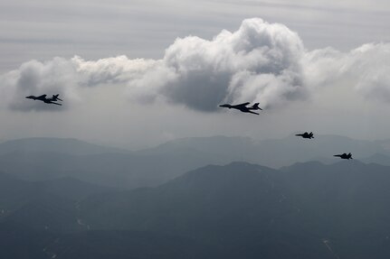 Two U.S. Air Force B-1B Lancers deployed to Andersen Air Base, Guam, and two F-15K Slam Eagles assigned to Daegu Air Base, Republic of Korea, fly over ROK skies Sept. 21, 2016. The flight was the closest a B-1 has ever flown to the border between the ROK and North Korea. The B-1 is the backbone of the U.S. long-range bomber mission and is capable of carrying the largest payload of both guided and unguided weapons in the Air Force inventory. (Republic of Korea air force photo by Chief Master Sgt. Kim, Kyeong Ryul)
