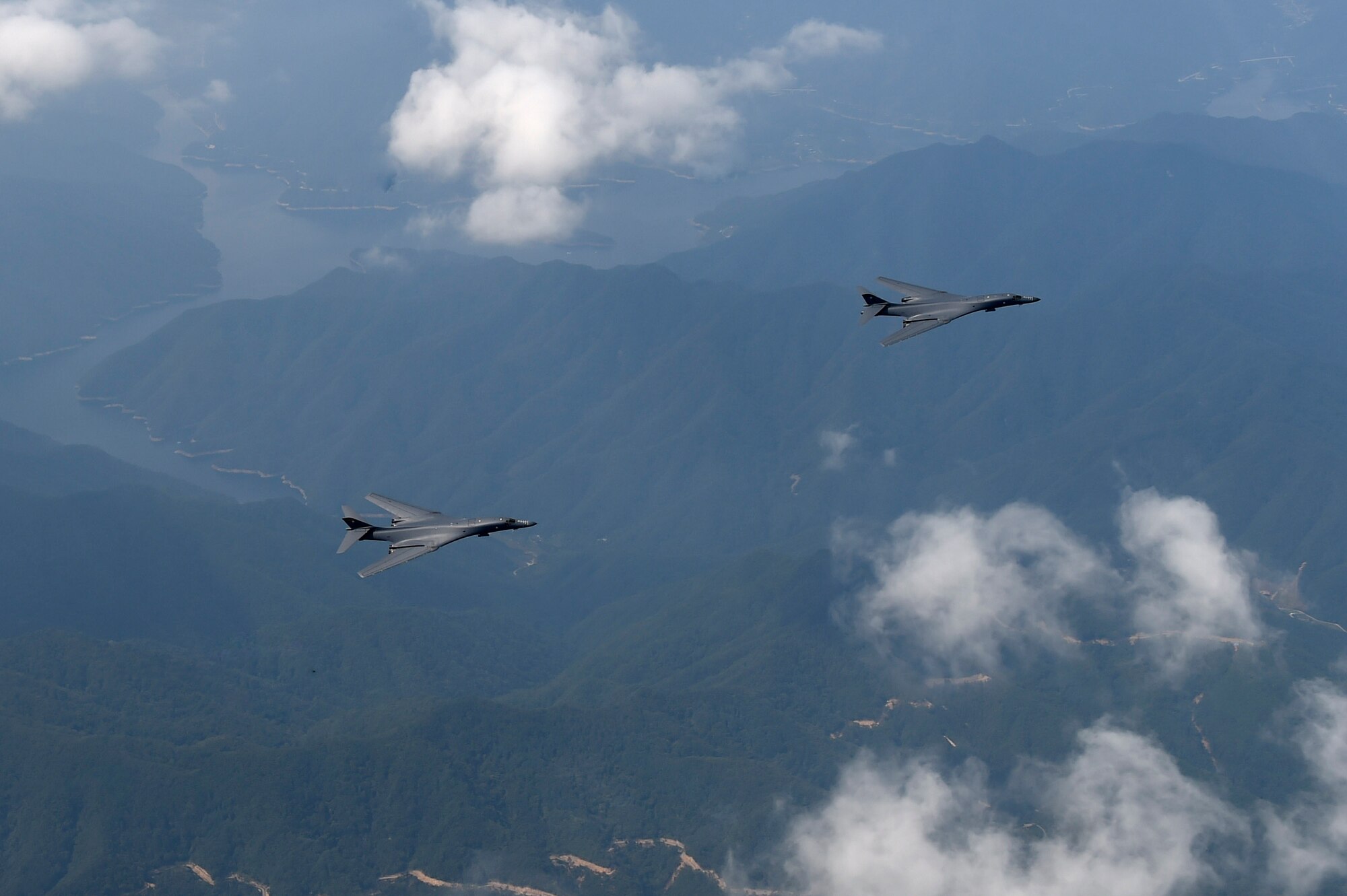 Two U.S. Air Force B-1B Lancers deployed to Andersen Air Base, Guam, fly over Republic of Korean skies Sept. 21, 2016. The flight was the closest a B-1 has ever flown to the border between the ROK and North Korea. The B-1 is the backbone of the U.S. long-range bomber mission and is capable of carrying the largest payload of both guided and unguided weapons in the Air Force inventory. (Republic of Korea air force photo by Chief Master Sgt. Kim, Kyeong Ryul)