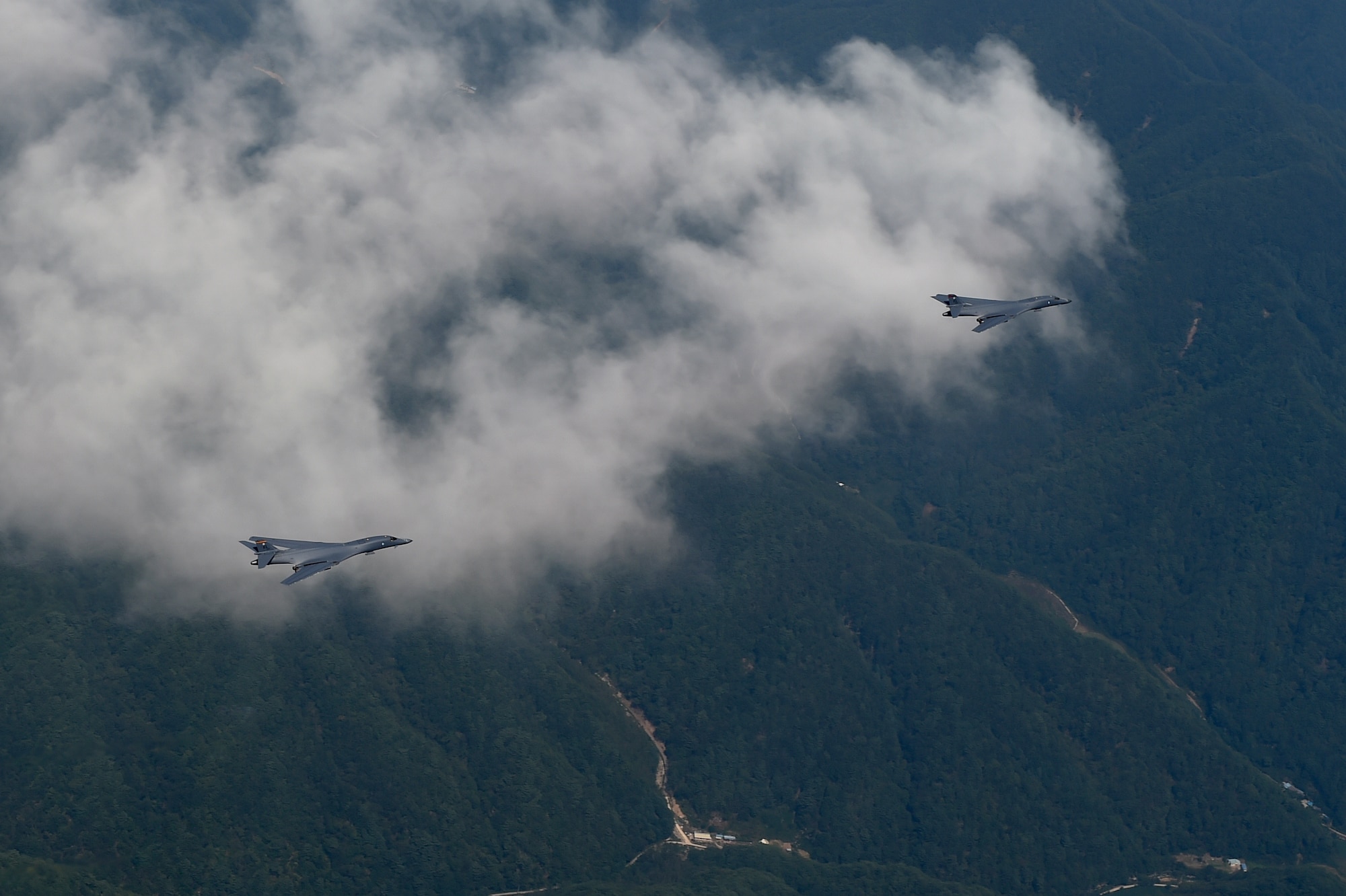 Two U.S. Air Force B-1B Lancers deployed to Andersen Air Base, Guam, fly over Republic of Korean skies Sept. 21, 2016. The flight was the closest a B-1 has ever flown to the border between the ROK and North Korea. The B-1 is the backbone of the U.S. long-range bomber mission and is capable of carrying the largest payload of both guided and unguided weapons in the Air Force inventory. (Republic of Korea air force photo by Chief Master Sgt. Kim, Kyeong Ryul)