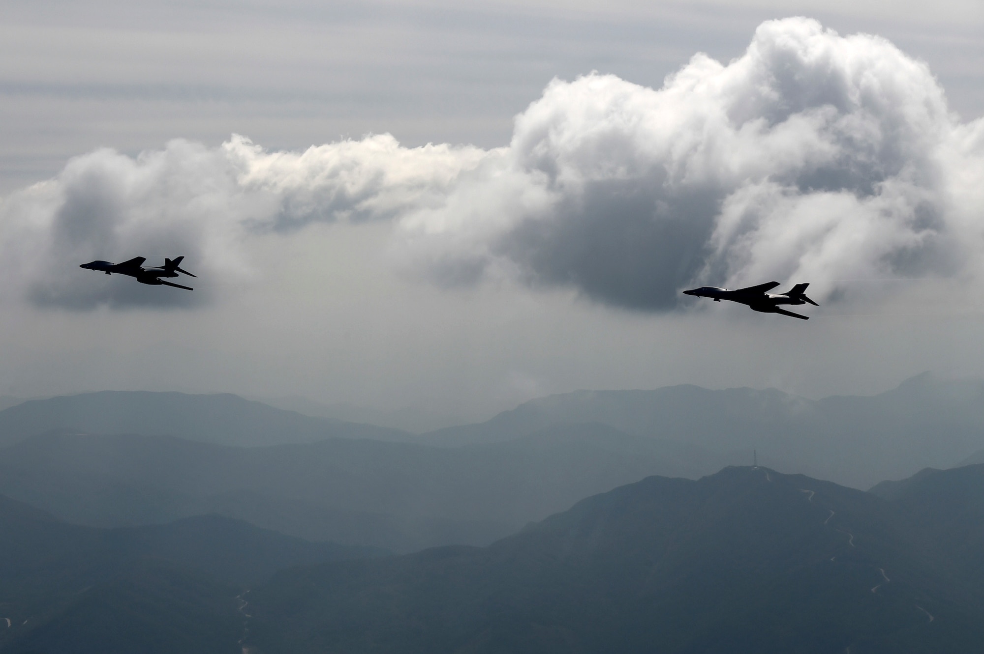 Two U.S. Air Force B-1B Lancers deployed to Andersen Air Base, Guam, fly over Republic of Korean skies Sept. 21, 2016. The flight was the closest a B-1 has ever flown to the border between the ROK and North Korea. The B-1 is the backbone of the U.S. long-range bomber mission and is capable of carrying the largest payload of both guided and unguided weapons in the Air Force inventory. (Republic of Korea air force photo by Chief Master Sgt. Kim, Kyeong Ryul)