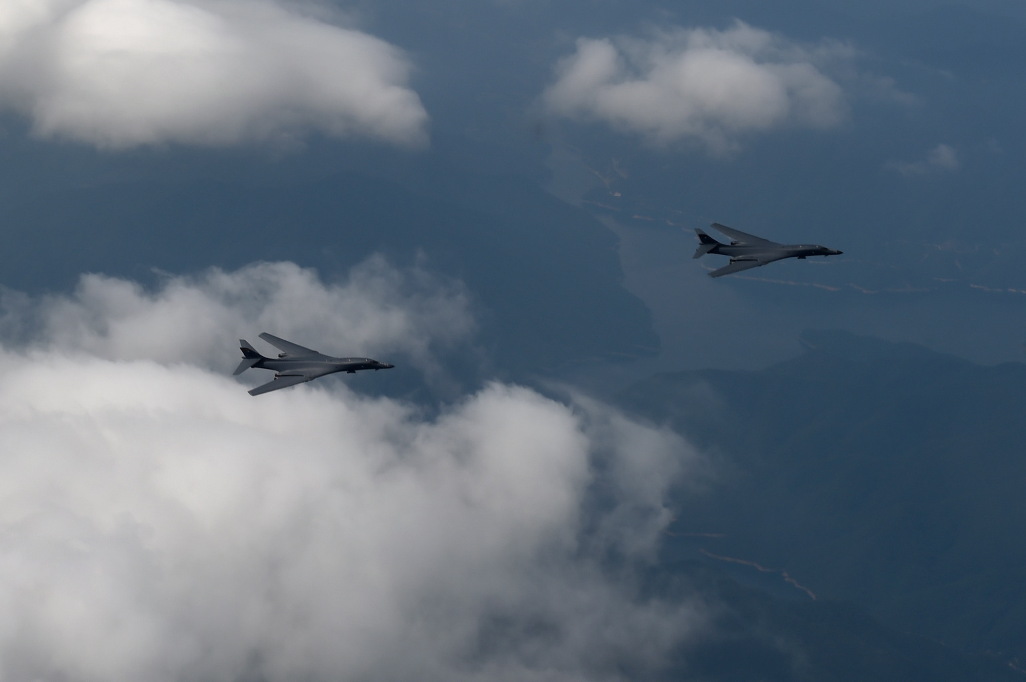 Two U.S. Air Force B-1B Lancers deployed to Andersen Air Base, Guam, fly over Republic of Korean skies Sept. 21, 2016. The flight was the closest a B-1 has ever flown to the border between the ROK and North Korea. The B-1 is the backbone of the U.S. long-range bomber mission and is capable of carrying the largest payload of both guided and unguided weapons in the Air Force inventory. (Republic of Korea air force photo by Chief Master Sgt. Kim, Kyeong Ryul)