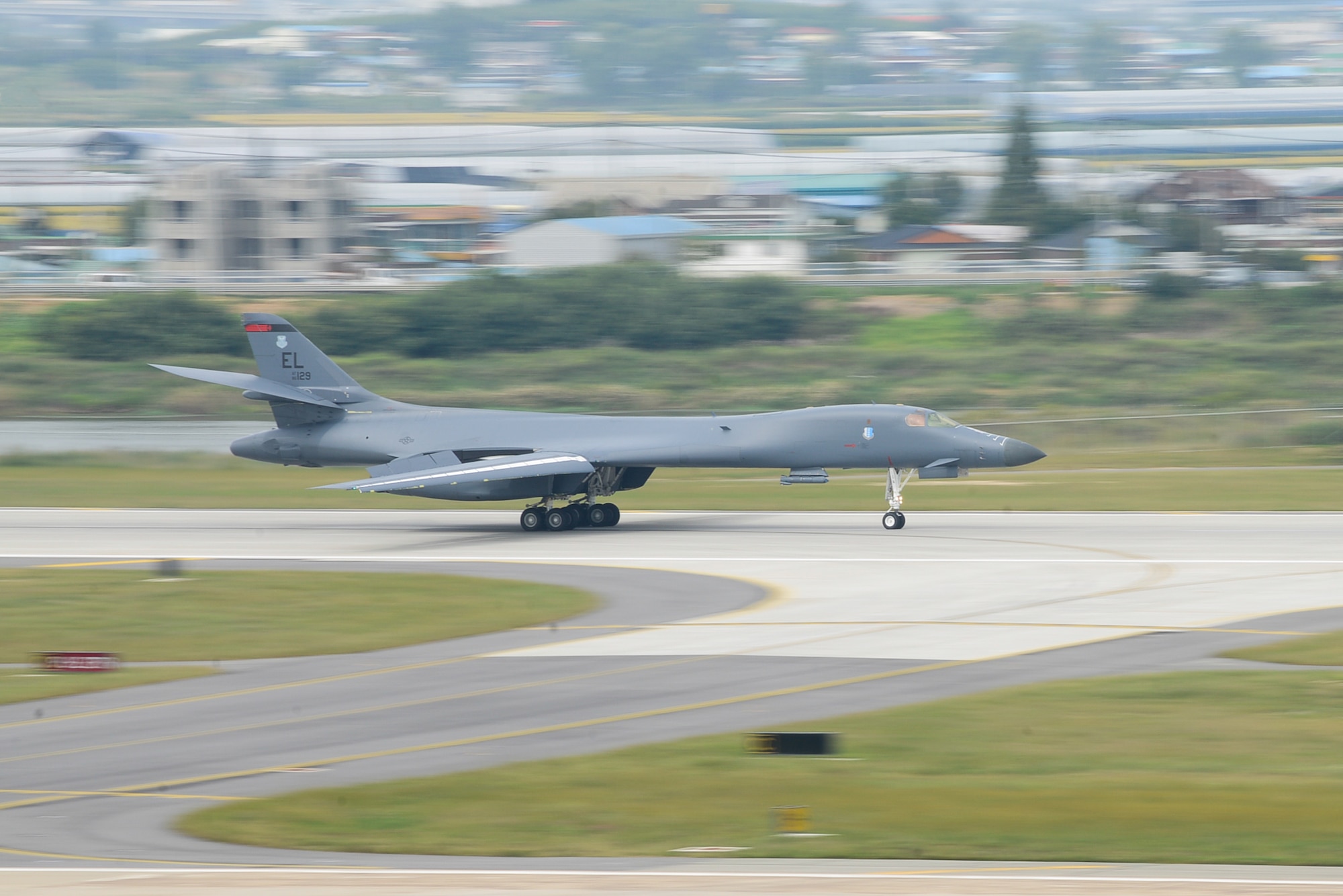 A U.S. Air Force B-1B Lancer assigned to Andersen Air Base, Guam, performs a landing at Osan Air Base, Republic of Korea. Sept. 21, 2016. The B-1 is the backbone of the U.S. long-range bomer mission and is capable of carrying the largest payload of both guided and unguided weapons in the Air Force Inventory. The flight was the closest a B-1 has ever flown to the border between the Republic of Korea and North Korea. (U.S. Air Force photo by Senior Airman Dillian Bamman)