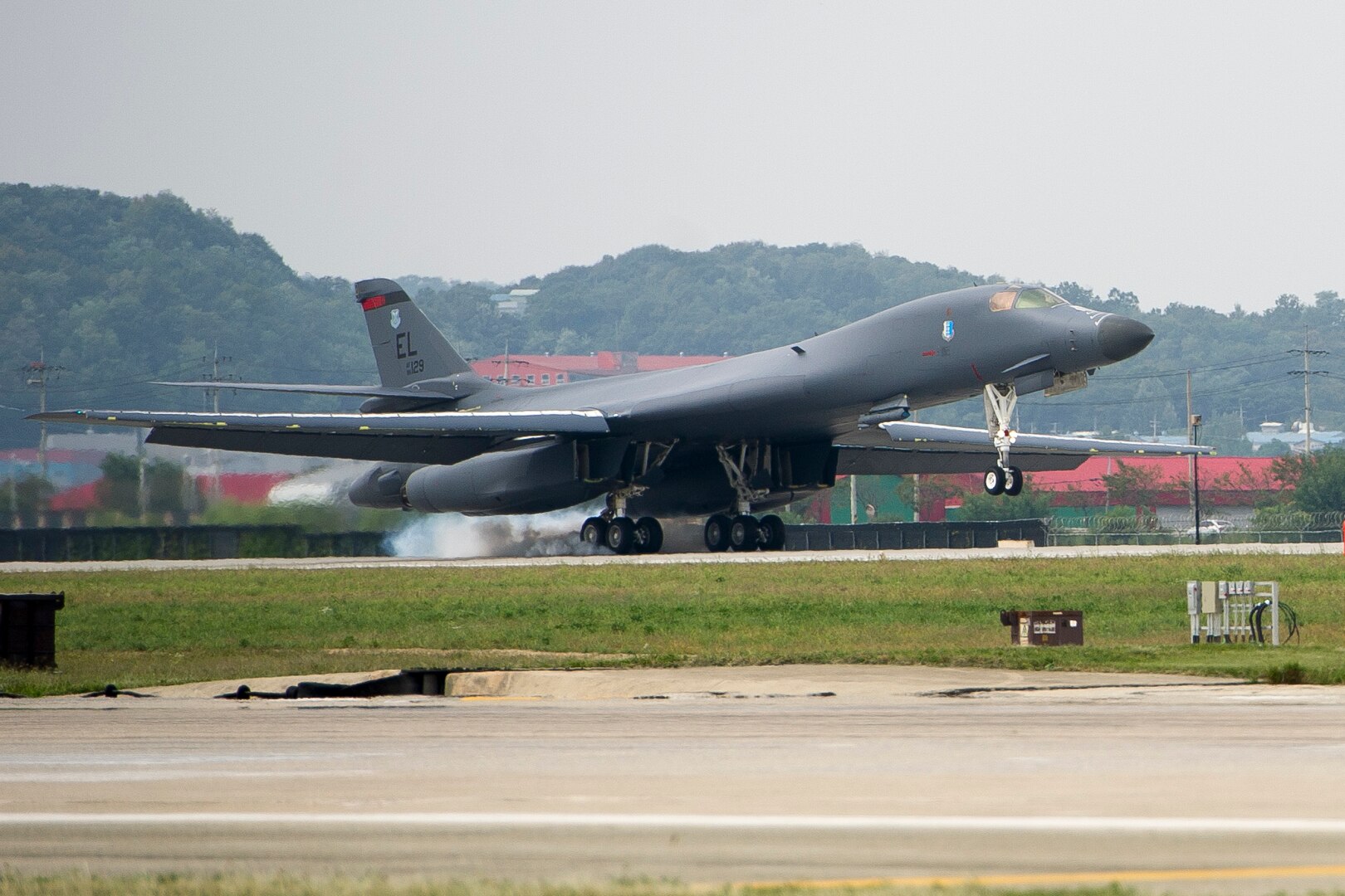 A U.S. Air Force B-1B Lancer deployed from Andersen Air Base, Guam, performs a landing at Osan Air Base, Republic of Korea, Sept. 21, 2016. This is the first time the Lancer has landed on the Korean peninsula in 20 years. The B-1 is the backbone of the U.S. long-range bomber mission and is capable of carrying the largest payload of both guided and unguided weapons in the Air Force inventory.(U.S. Air Force photo by Staff Sgt. Jonathan Steffen)