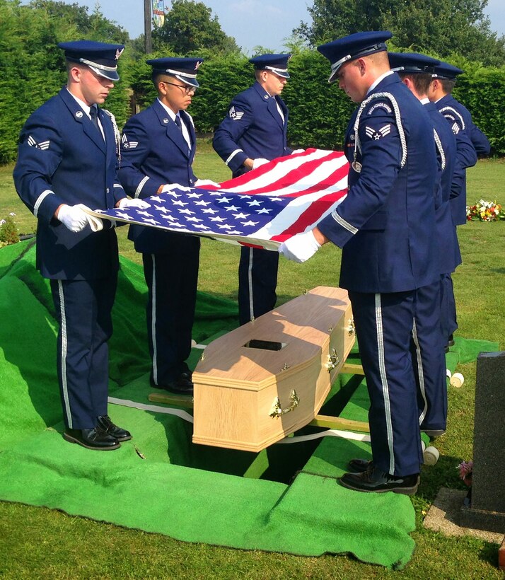 U.S. Air Force Tech. Sgt. James Stay, third from left, 100th Logistics Readiness Squadron NCO in charge of Mobility Readiness Spares Packaging, and NCO in charge of Honor Guard, folds a flag during a funeral, summer 2015, in Beck Row, England. The Honor Guard performs funerals for service members in areas covering Northern Ireland and Wales as well as south of Birmingham. (Courtesy photo)