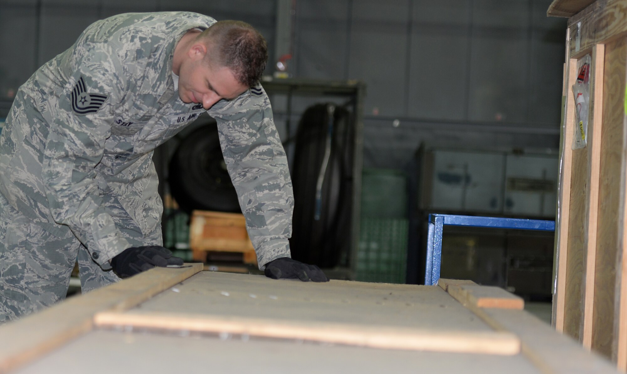 U.S. Air Force Tech. Sgt. James Stay, 100th Logistics Readiness Squadron NCO in charge of Mobility Readiness Spares Packaging, and NCO in charge of Honor Guard, checks the documentation on a box containing parts Sept. 14, 2016, on RAF Mildenhall, England. Each part needs properly documented at all times to ensure they are accounted for. (U.S. Air Force photo by Gina Randall)