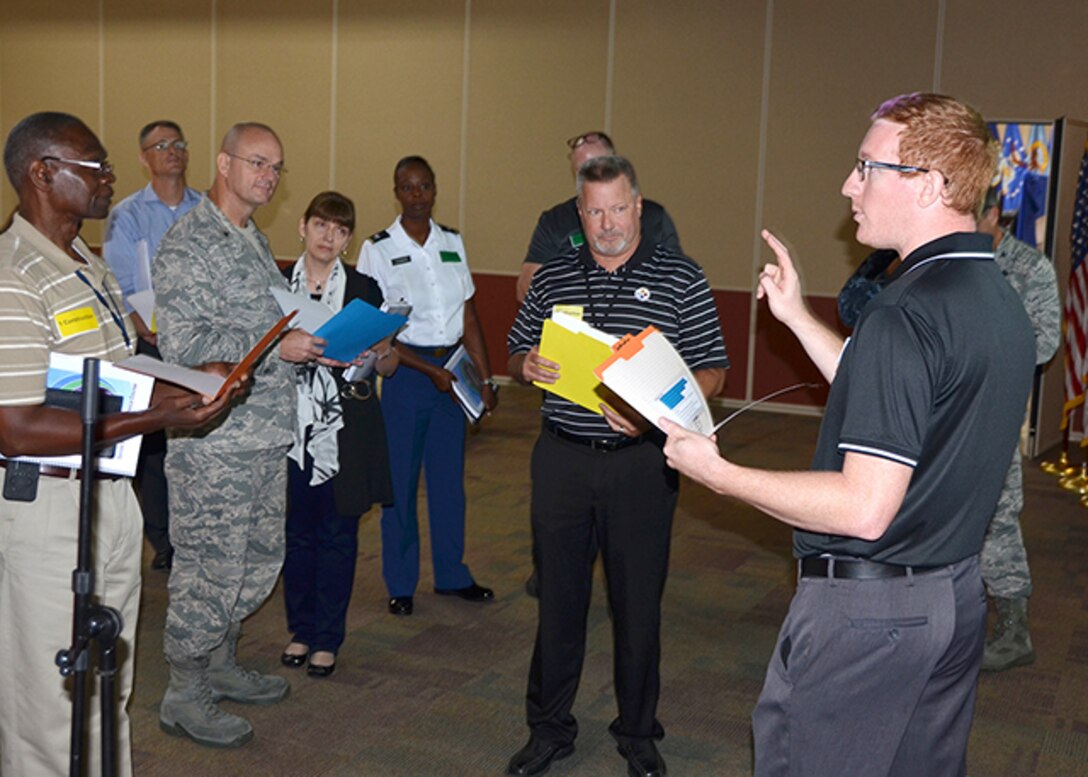 Chris Basden, Aviation Process Excellence Transformation team lead, Defense Logistics Agency Aviation at Oklahoma City, pre-briefs team members on their task during an APEX training exercise in the Lotts Conference Center Sept. 8-9 on Defense Supply Center Richmond, Virginia. (