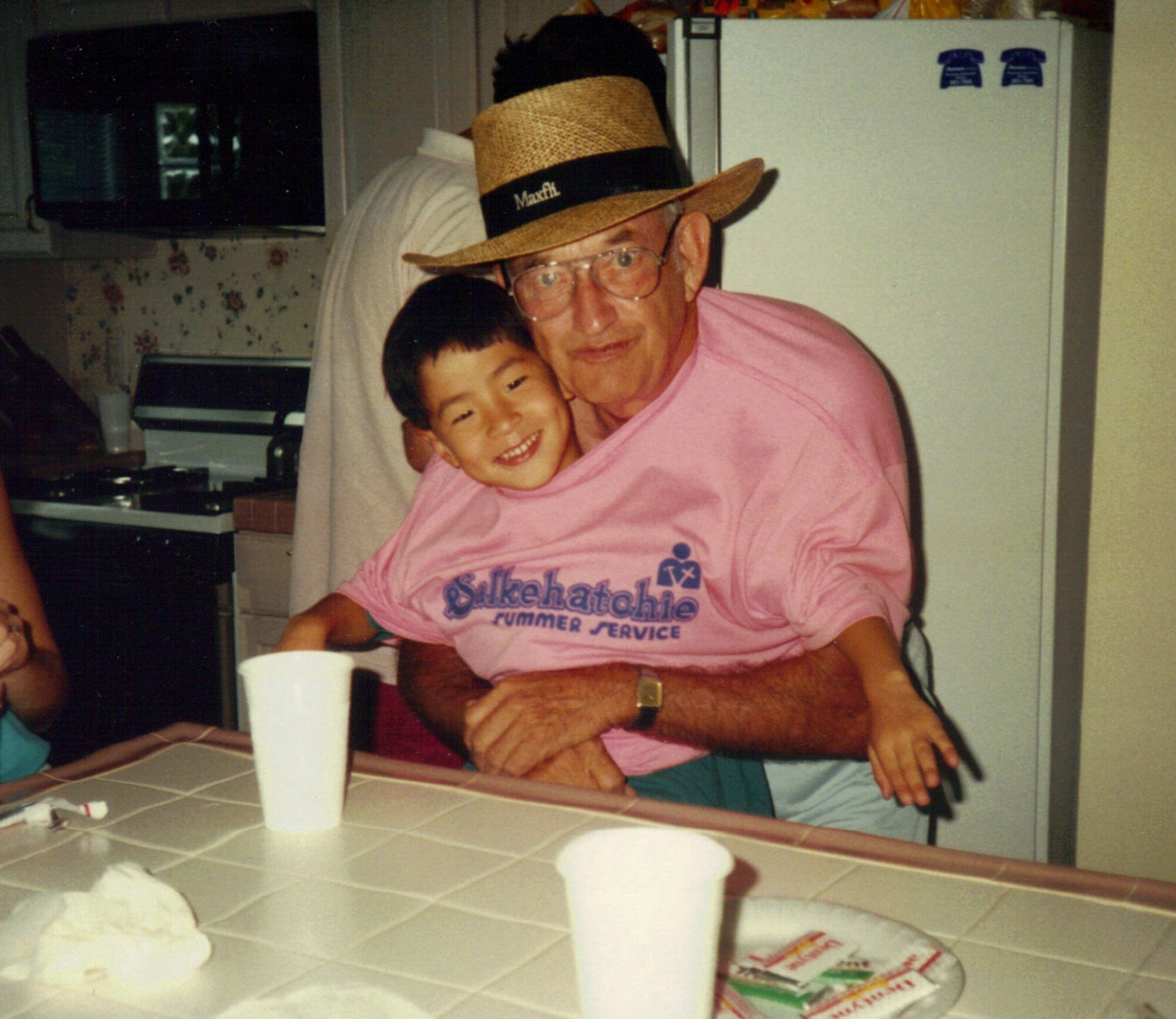 The late Harry Burdette visiting with his grandson, then 5-year-old Shawn Jensen, in 1990 in San Antonio, Texas.  Jensen, now an RC-135 Rivet Joint pilot with the 763rd Expeditionary Reconnaissance Squadron, has always admired the spiritual strength of both his grandfather, a B-17 Flying Fortress pilot who flew for the 379th Bombardment Group in World War II, and his father, a retired F-16 Fighting Falcon pilot. (Courtesy photo/Richard Burdette/Released)    