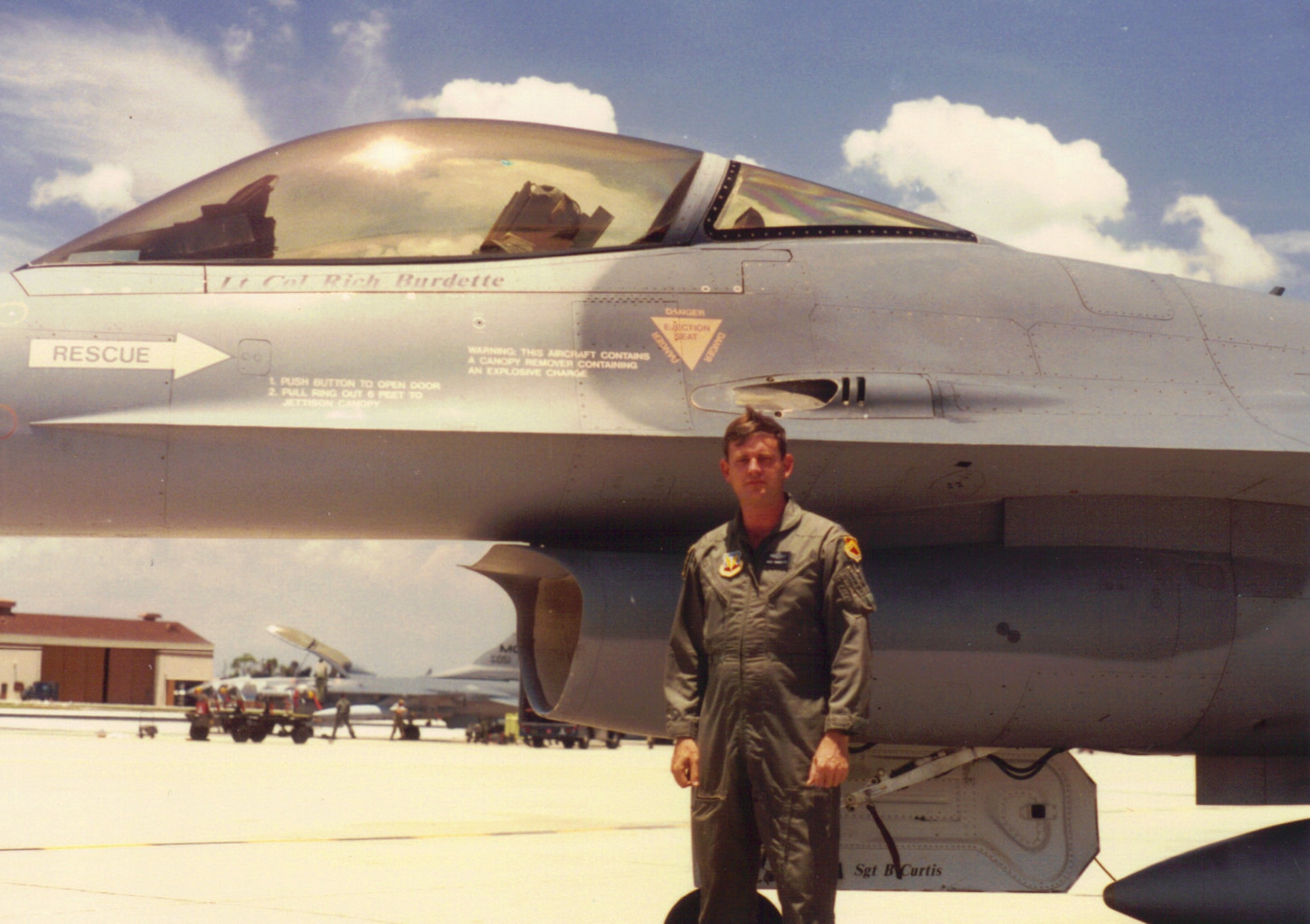 Retired Lt. Col. Richard Burdette poses for a photo with his F-16 Fighting Falcon at MacDill Air Force Base, Fla., in 1990.  According to him, the best pilot from the three generations in his family was his father.  His father, 2nd Lt. Harry Burdette, flew an unpressurized B-17 Flying Fortress above 30,000 feet and had to wear a flight suit plugged into the aircraft’s electrical system for warmth while assigned to the 379th Bombardment Group during World War II. (Courtesy photo/Richard Burdette/Released)    