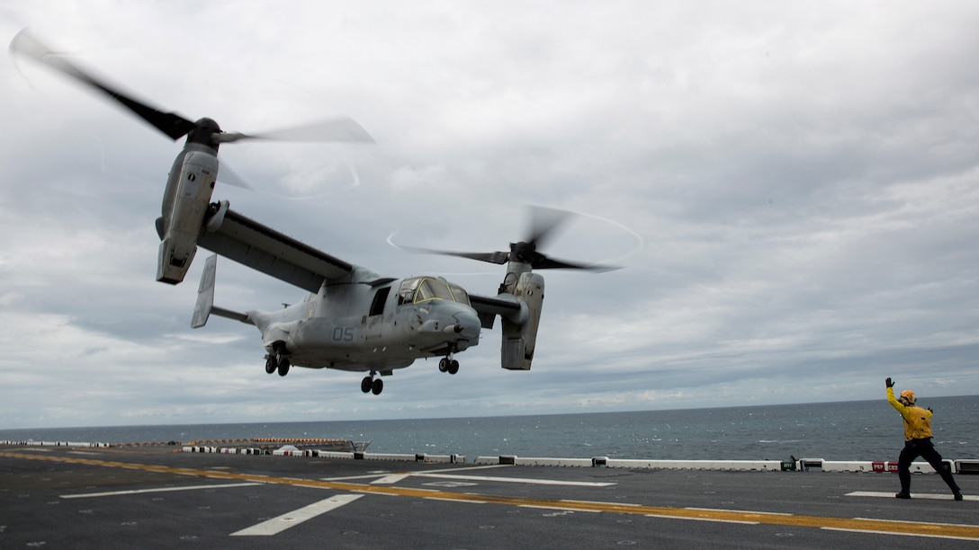 A MV-22 Osprey with Marine Medium Tiltrotor Squadron 365 departs USS Bataan during Amphibious Squadron Marine Expeditionary Unit Integration Training at sea, Sept. 15 2016. PMINT familiarizes Marines and sailors with amphibious operations and to safely execute embarkation training in preparation for future pre-deployment exercises. 