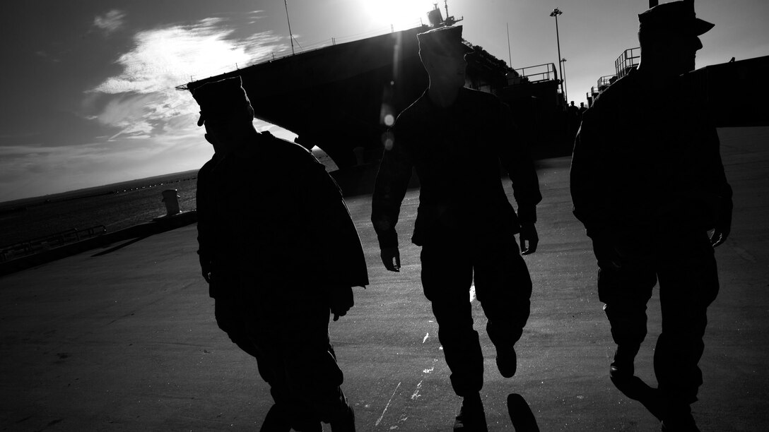 Marines with the 24th Marine Expeditionary Unit make their way off USS Bataan for a liberty period Sept. 12, 2016 at the Norfolk Naval Shipyard, Virginia. Marines and sailors with the MEU recently cam aboard the ship for Amphibious Squadron 8 MEU integrated Training. PMINT allows the MEU to refine standard operating procedures for shipboard drills, safely conduct ship to shore execution of MEU missions and master the basics of shipboard life. 