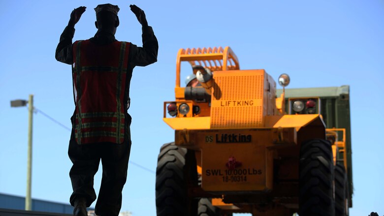 Marines with Combat Logistics Battalion 24 conduct an on-load of vehicles and supplies to the USS Mesa Verde in preparation for the 24th Marine Expeditionary Unit's first training exercise, PHIBRON-MEU Integrated Training Sept. 13, 2016 at Morehead City Port, North Carolina. The exercise encompasses several aspects of the MEU mission, and is intended to acclimate Marines and sailors to operations on-ship and to master the basics of ship life.