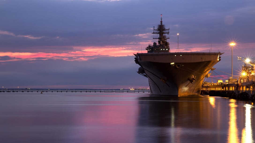 USS Bataan rests in port Sept. 11, 2016 at the Norfolk Naval Shipyard, Virginia. Marines and sailors with the 24th Marine Expeditionary Unit recently cam aboard the ship for Amphibious Squadron 8 MEU integrated Training. PMINT allows the MEU to refine standard operating procedures for shipboard drills, safely conduct ship to shore execution of MEU missions and master the basics of shipboard life. 