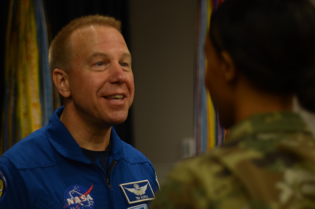 NASA astronaut Timothy L. Kopra, a flight engineer for Expedition 46 and the mission commander for Expedition 47, participates in a photo op after sharing details of his recent mission to the International Space Station with faculty and students at the Defense Information School  on Sept. 13, 2016. Kopra landed in Kazakhstan on June 18, 2016, and is now on a 180-day post-flight tour. NASA’s public affairs office coordinates events like the one at DINFOS so Kopra can share highlights of his experience in space with the public. 