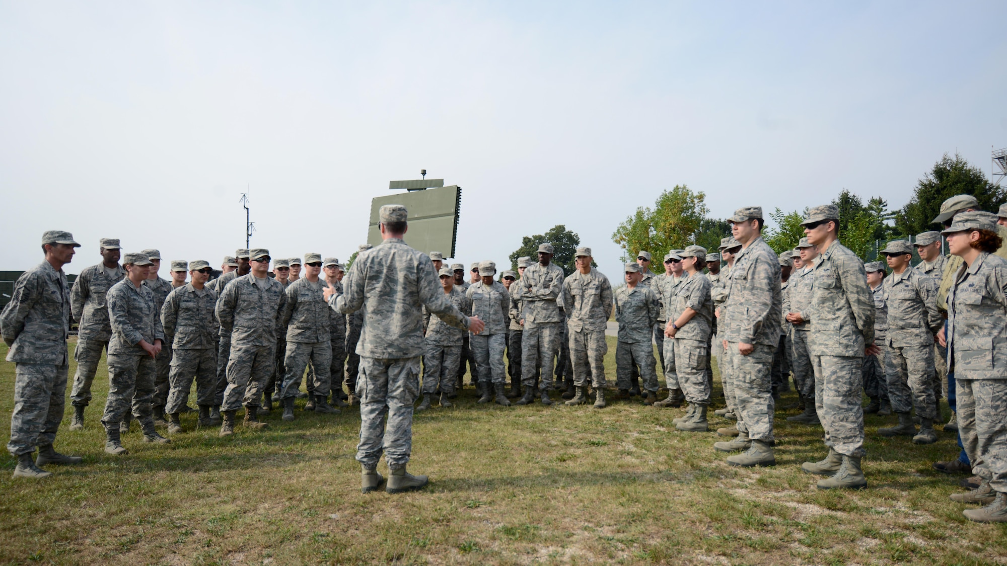 Members of the 606th Air Control Squadron listen to Lt. Col. Aaron Gibney, 606th ACS commander, during the unveiling of the squadron’s new home at Aviano Air Base, Italy on Sept. 15, 2016. The 606th ACS moved from Spangdahlem Air Base, Germany to Aviano as part of the European Infrastructure Consolidation. (U.S. Air Force photo by Staff Sgt. Andrew M. Satran/Released)