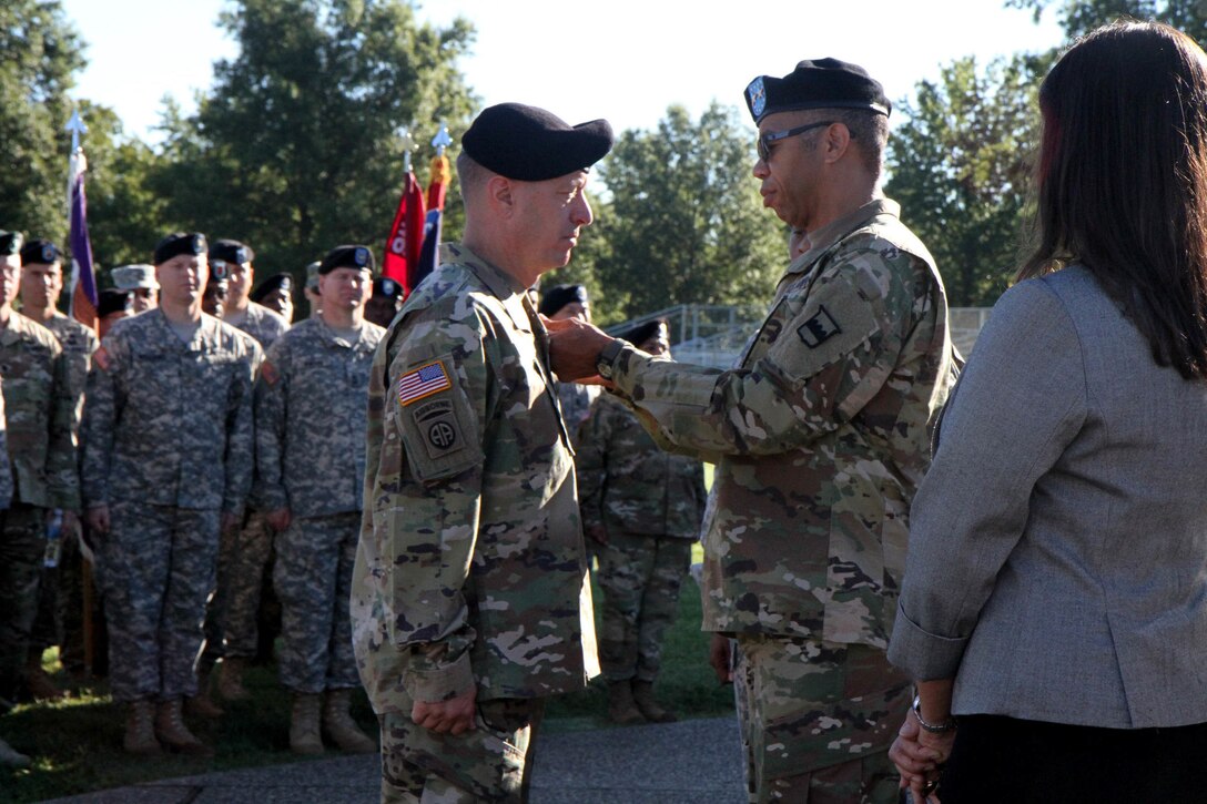 Maj. Gen. A. C. Roper, the commander of the 80th Training Command (TASS), pins the prestigious Legion of Merit on Brig. Gen. Jason L. Walrath, the outgoing commander of the 100th Training Division Operations Support, in recognition of Walrath's numerous accomplishments during his tenure as the division's commanding general. Walrath took command of the 100th Division back in September of 2014 and will go on to become the Deputy Commanding General - Support of the U.S. Army Recruiting Command. Brig. Gen. Aaron T. Brig. Gen. Aaron T. Walter assumed command of the 100th TD after Walrath formally relinquished his leadership duties during a change of command ceremony at Brooks Parade Field Fort Knox, Ky., Sept. 11, 2016.