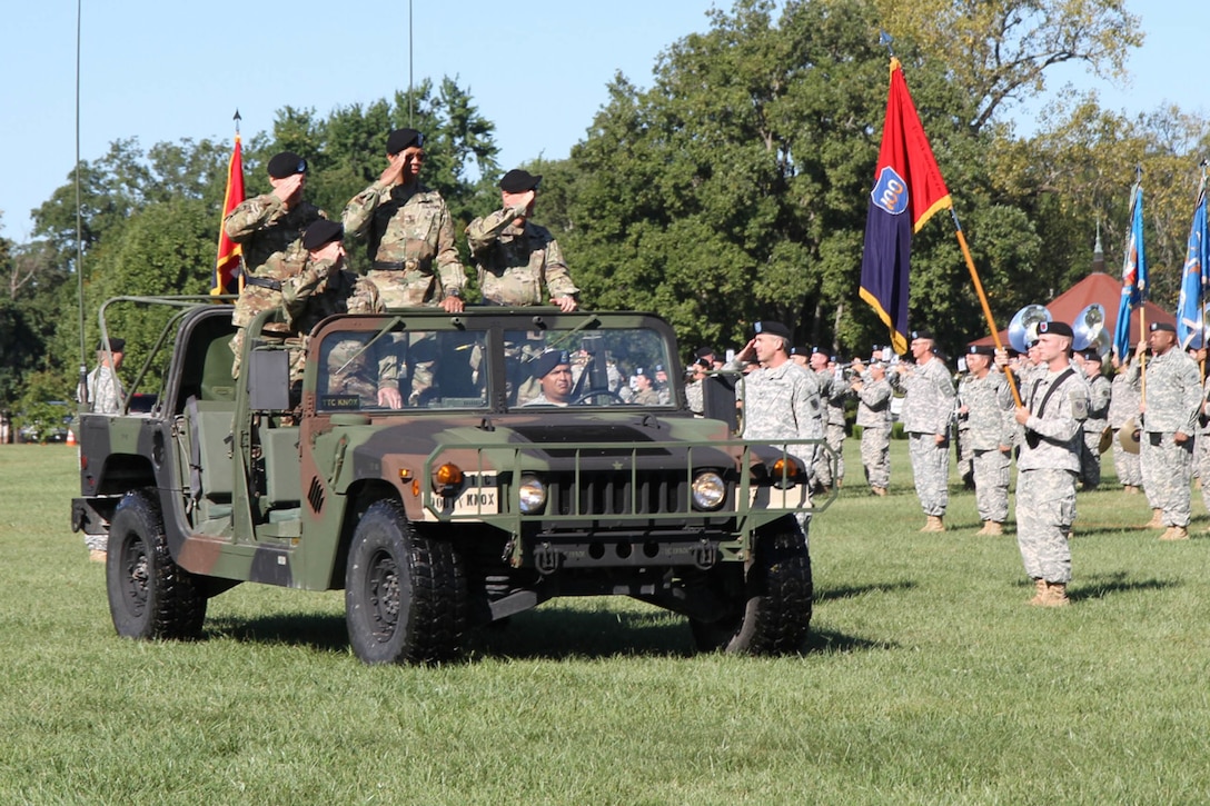 Brig. Gen. Aaron T. Walter, the incoming commander of the 100th Training Division (left), Maj. Gen. A. C. Roper, the commander of the 80th Training Command (TASS) (middle), and Brig. Gen. Jason L. Walrath, outgoing commander of the 100th Division (right), survey the brigades from a jeep during the "Trooping the Line" portion of the 100th Division's Change of Command Ceremony at Brooks Parade FIeld, Fort Knox, Ky. on Sept. 11, 2016. Walter assumed command of the 100th TD after Walrath formally relinquished his leadership duties during the Sunday morning ceremony hosted by Roper.