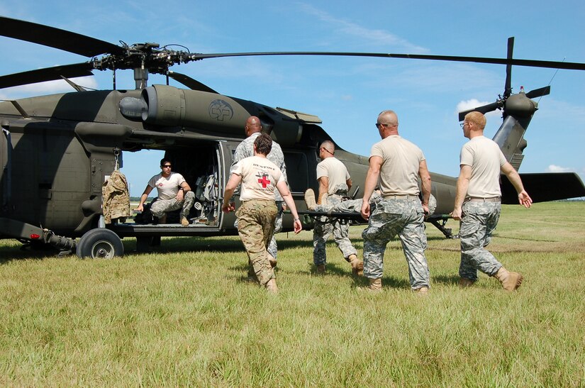 Army Reserve Medical Command Soldiers from Tampa-based 7222nd Medical Support Unit joined Soldiers from F Company, 5-159th Aviation MEDEVAC unit and Air Force personnel with 927th Aeromedical Staging Training Squadron to execute their portion of the MASCAL exercise on MacDill Air Force Base.  Trainers from F Co., 5-159th Aviation MEDEVAC unit go over guidelines for loading casualties into their aircraft.  Training for mass casualty events is conducted to improve efficiencies in how patients are handled to address as many affected personnel as possible based on the severity of the injury and number of patients needing assistance.