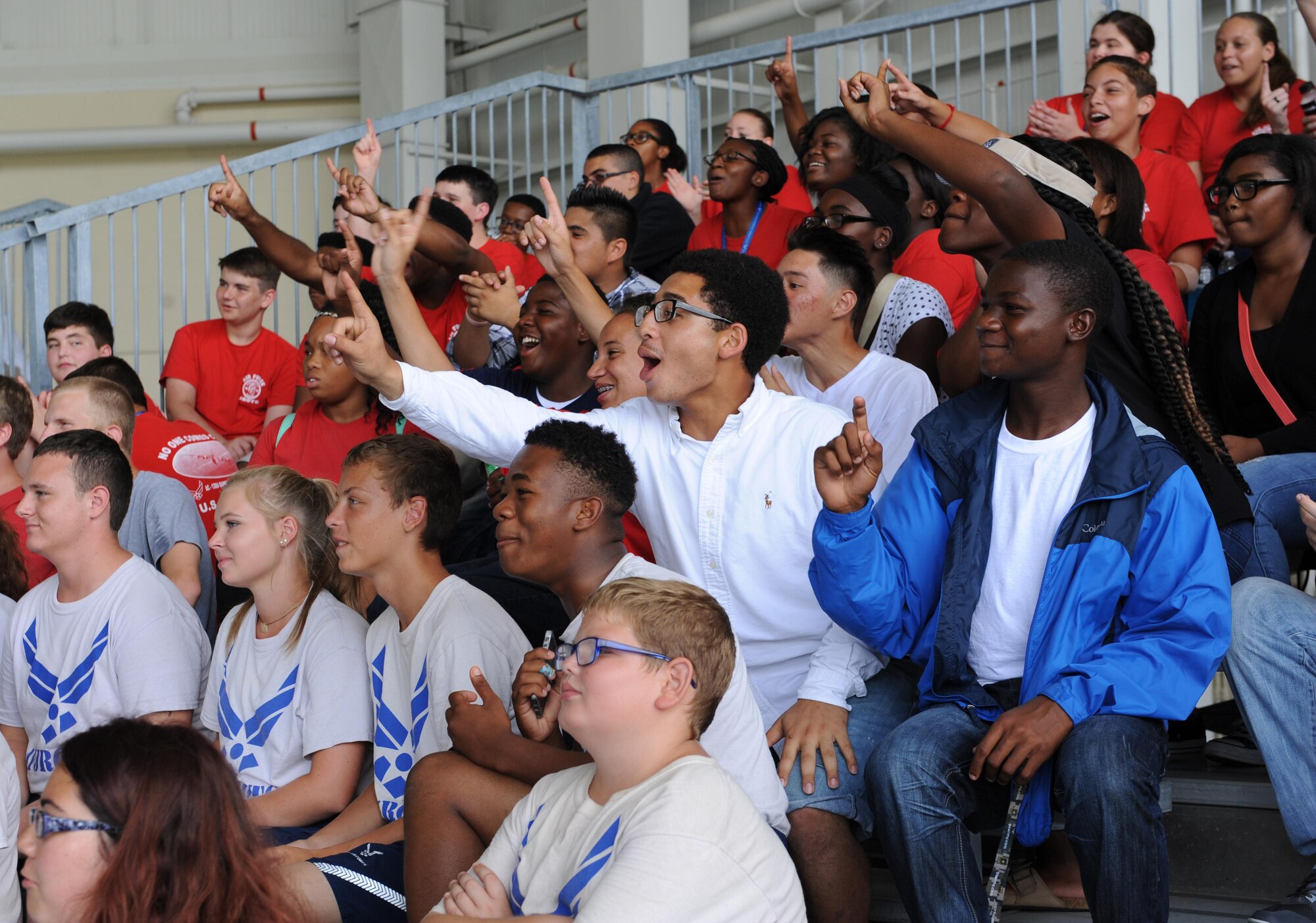 Harrison Central High School Junior ROTC students cheer on a fellow cadet during a pull-up competition during the Science, Technology, Engineering and Mathematics Diversity Outreach Day at the fuel cell hangar Sept. 16, 2016 on Keesler Air Force Base, Miss. The event also consisted of nine Mississippi gulf coast high school Junior ROTC units and science students viewing an 81st Security Forces Squadron military working dog demonstration and visiting informative booths about Air Force opportunities and accession requirements with an emphasis on STEM. (U.S. Air Force photo by Kemberly Groue/Released)