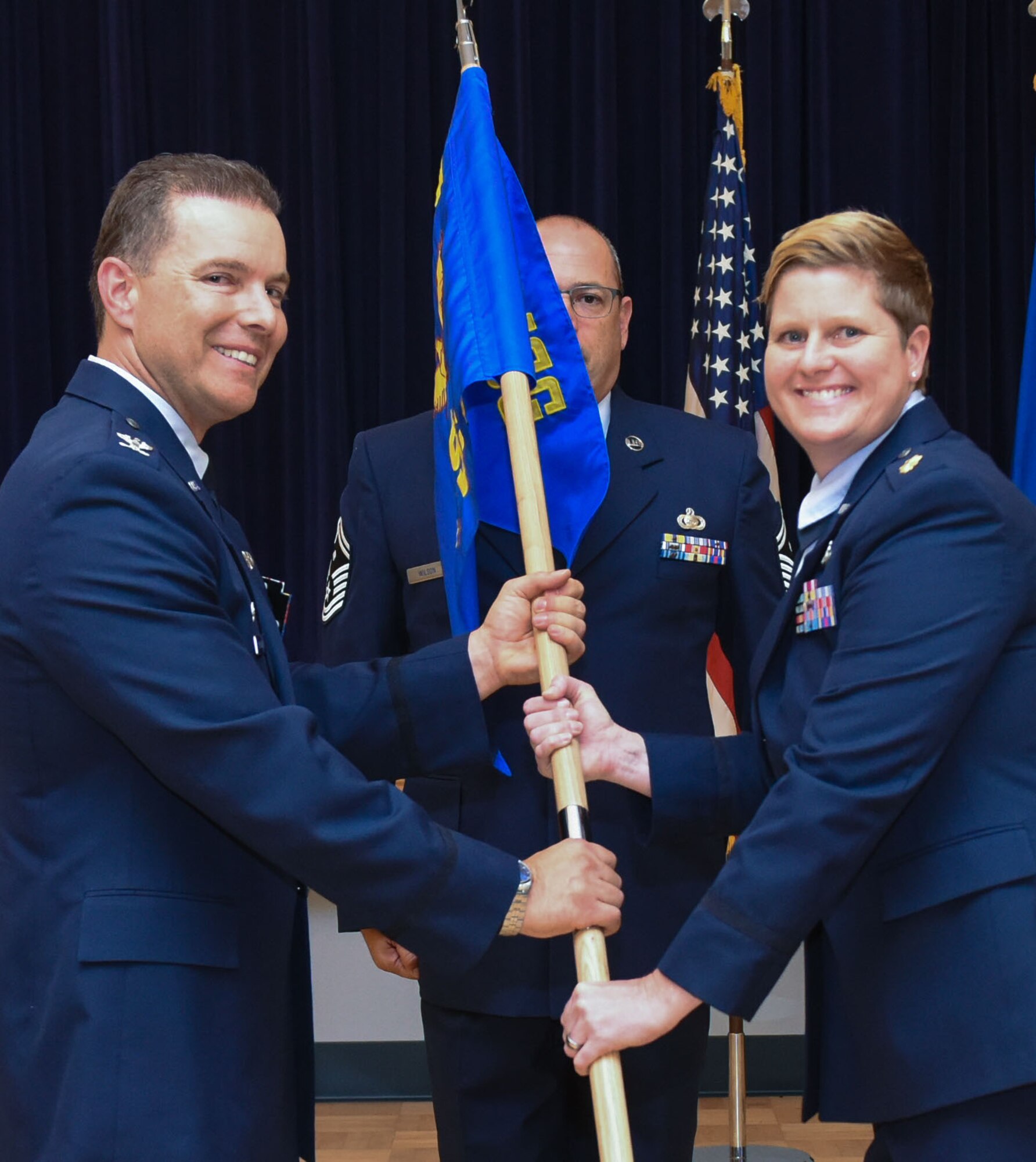 Maj. Alicia K. LaPray, 940th Force Support Squadron commander, receives the squadron guidon from Col. Roderick T. Grunwald, 940th Mission Support Group commander, during a change of command ceremony Sept. 10, 2016, at Beale Air Force Base, California. A change of command ceremony is a long standing military tradition dating back to the Middle Ages that formally recognizes the transfer of authority from one commanding officer to another. (U.S. Air Force photo by Staff Sgt. Brenda Davis)