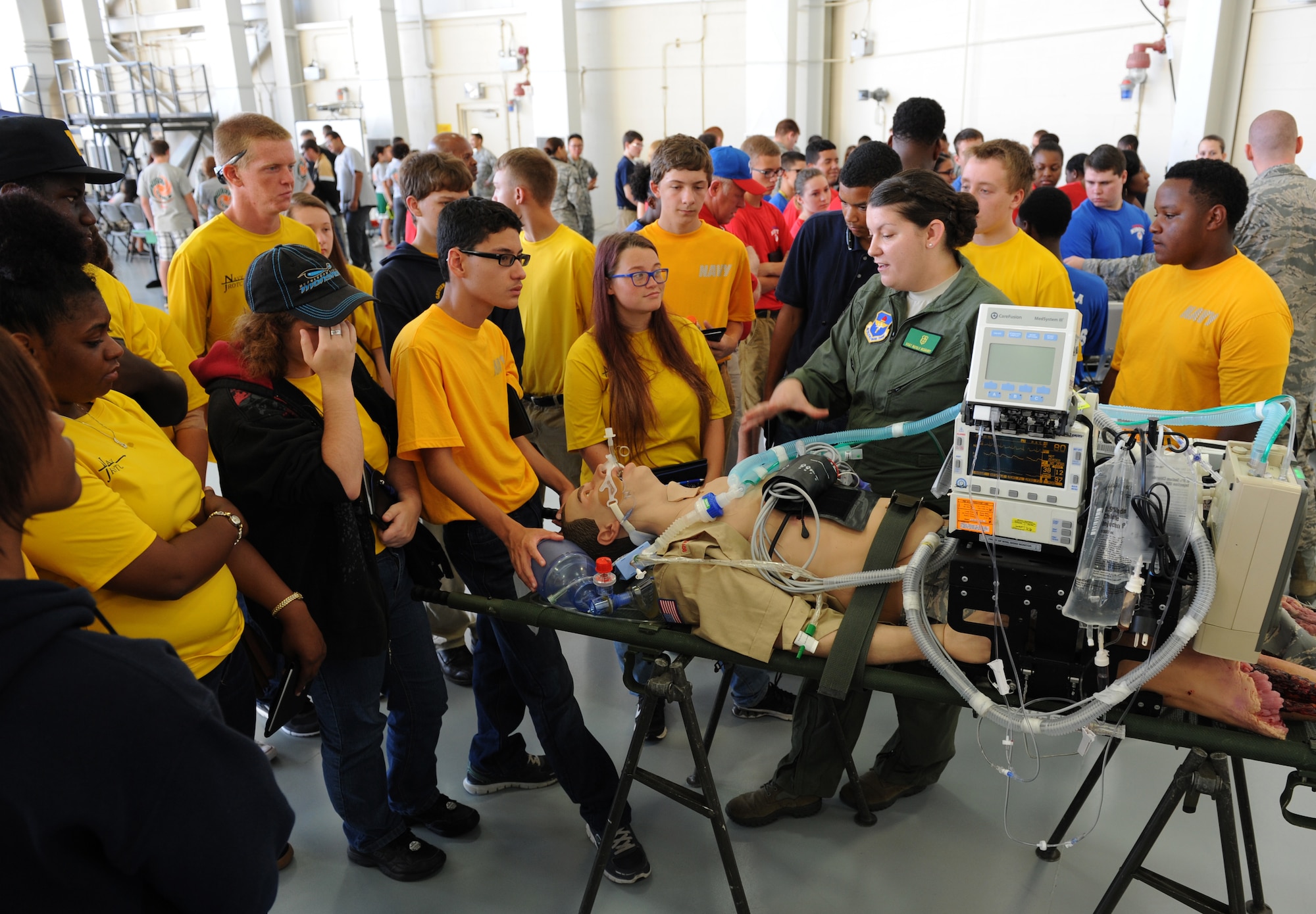 Staff Sgt. Nicole Richards, 81st Medical Operations Squadron respiratory therapy NCO in charge, provides an overview on the critical care air transport team capabilities during the Science, Technology, Engineering and Mathematics Diversity Outreach Day at the fuel cell hangar Sept. 16, 2016 on Keesler Air Force Base, Miss. The event consisted of nine Mississippi gulf coast high school Junior ROTC units and science students viewing an 81st Security Forces Squadron military working dog demonstration, participating in a pull-up competition and visiting informative booths about Air Force opportunities and accession requirements with an emphasis on STEM. (U.S. Air Force photo by Kemberly Groue/Released)