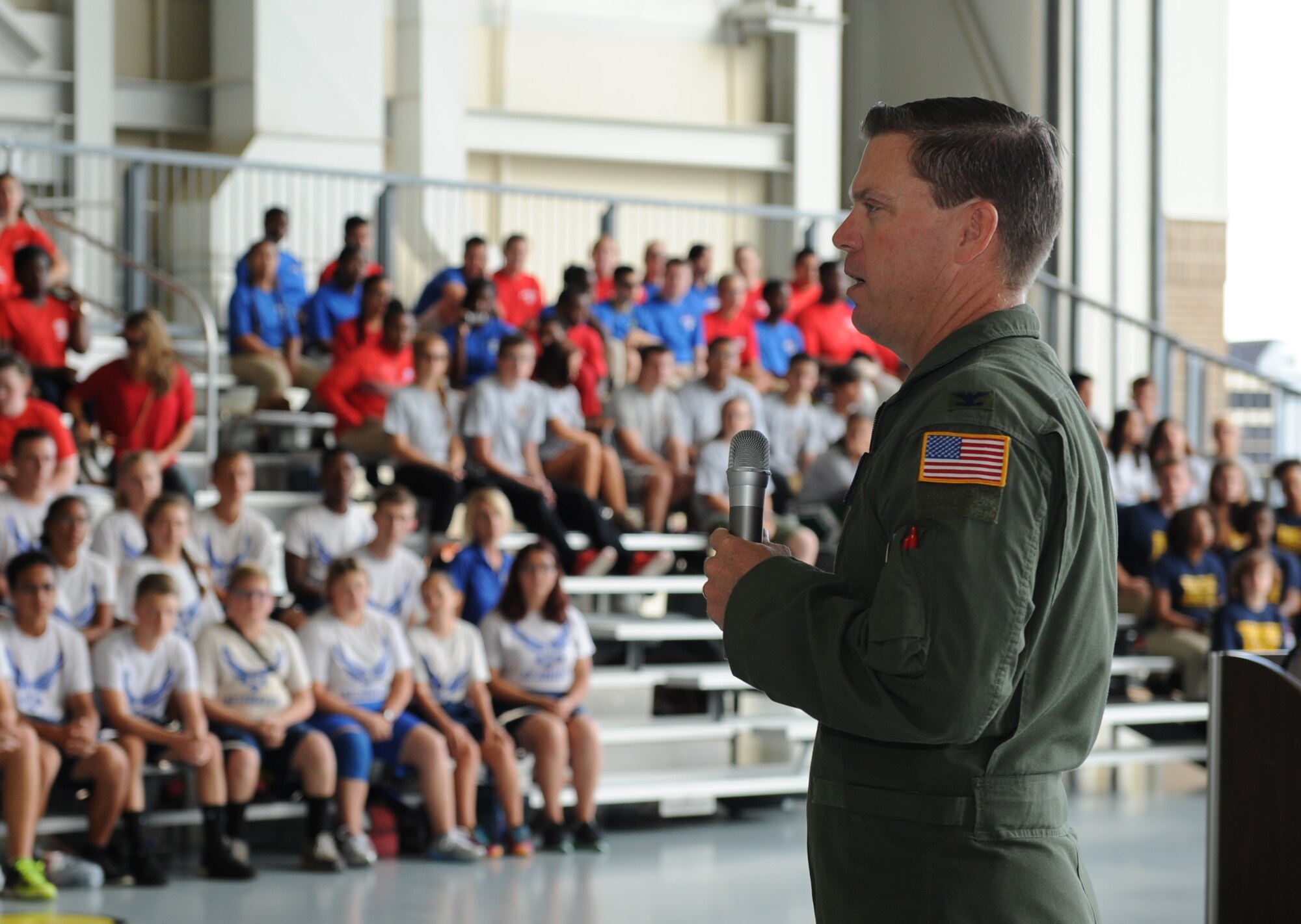 Col. C. Mike Smith, 81st Training Wing vice commander, delivers welcoming remarks to high school students during the Science, Technology, Engineering and Mathematics Diversity Outreach Day at the fuel cell hangar Sept. 16, 2016 on Keesler Air Force Base, Miss. The event consisted of nine Mississippi gulf coast high school Junior ROTC units and science students viewing an 81st Security Forces Squadron military working dog demonstration, participating in a pull-up competition and visiting informative booths about Air Force opportunities and accession requirements with an emphasis on STEM. (U.S. Air Force photo by Kemberly Groue/Released)