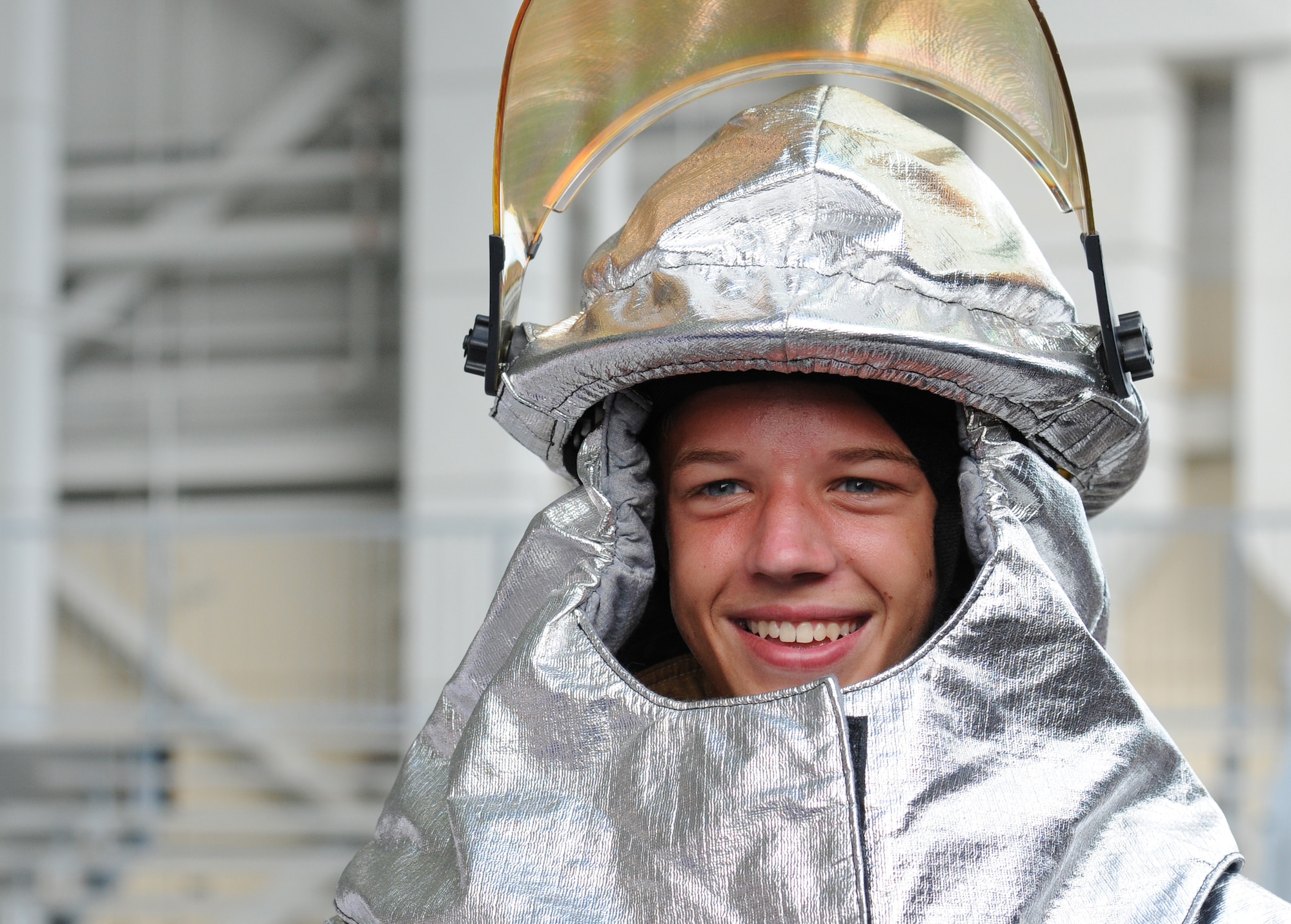 Cooper Simmons, St. Martin High School Junior ROTC student, wears a firefighter helmet during the Science, Technology, Engineering and Mathematics Diversity Outreach Day at the fuel cell hangar Sept. 16, 2016 on Keesler Air Force Base, Miss. The event consisted of nine Mississippi gulf coast high school Junior ROTC units and science students viewing an 81st Security Forces Squadron military working dog demonstration, participating in a pull-up competition and visiting informative booths about Air Force opportunities and accession requirements with an emphasis on STEM. (U.S. Air Force photo by Kemberly Groue/Released)