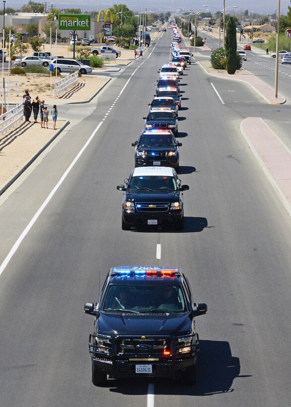 About 120 representatives from agencies across California participated to show support for fallen K-9 officer Ty from the California City Police Department. (U.S. Air Force photo by Kenji Thuloweit)
