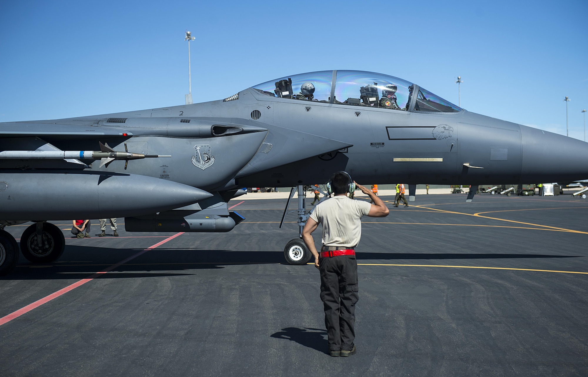 Airman 1st Class Joseph Rogel, 48th Aircraft Maintenance Squadron dedicated crew chief, salutes his F-15E Strike Eagle aircrew before a sortie in support of Tactical Leadership Programme 16-3 at Los Llanos Air Base, Spain Sept. 16. The training prepares NATO and allied forces’ flight leaders to be mission commanders, to lead coalition force air strike packages, to instruct allied flying and non-flying personnel in matters related to tactical composite air operations, and to provide tactical air expertise to NATO agencies. (U.S. Air Force photo/ Staff Sgt. Emerson Nuñez)