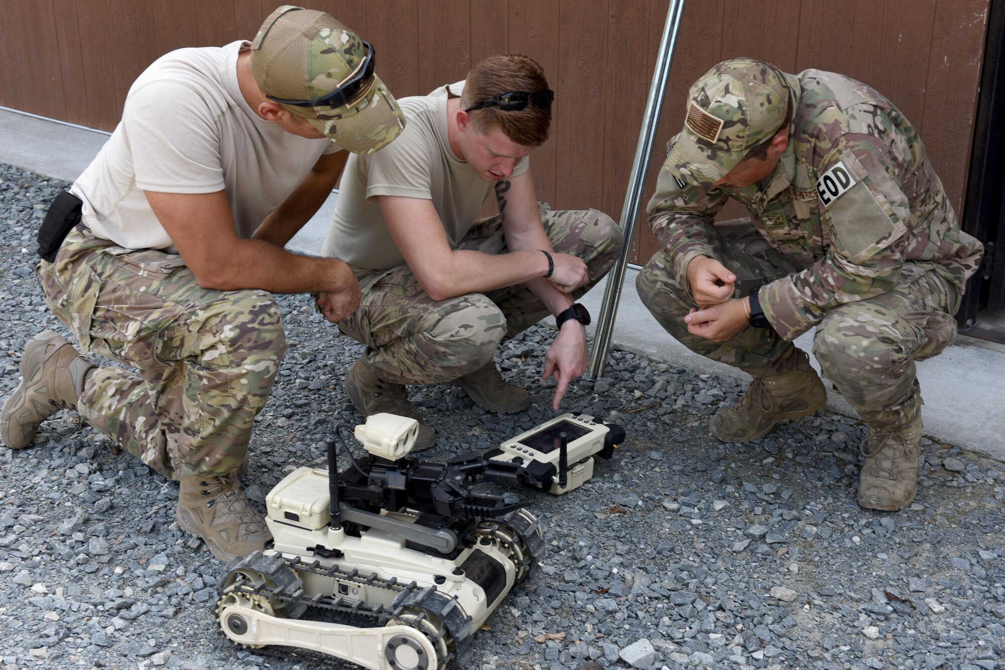 Explosive ordnance disposal Airmen from Joint Base Charleston, South Carolina, examine one of the three robots used in the EOD exercise, Sept. 14, 2016, at Seymour Johnson Air Force Base, North Carolina. The Airman were also accompanied by Marines from Camp Lejeune, North Carolina, during the exercise, and were able to participate in different EOD scenarios. (U.S. Air Force photo by Airman Miranda A. Loera)