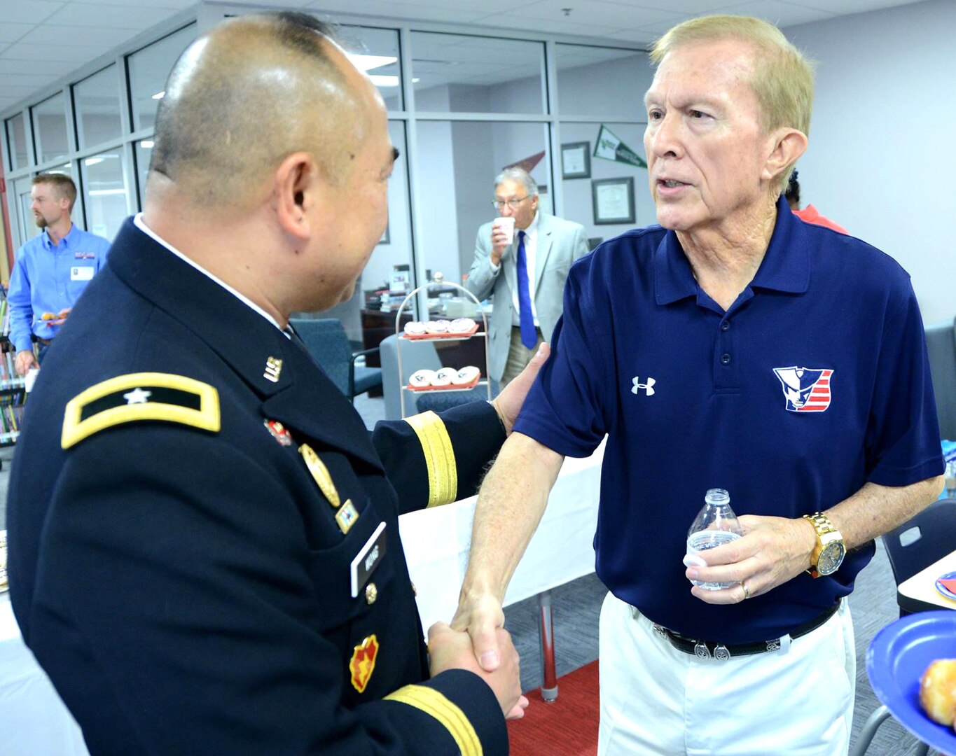 Brig. Gen. James Wong (left), U.S. Army South deputy commanding general and director of operations and National Guard affairs, speaks with Dr. Carl A. Montoya, Judson Independent School District superintendent, after a dedication ceremony at Veterans Memorial High School in San Antonio Sept. 9.
