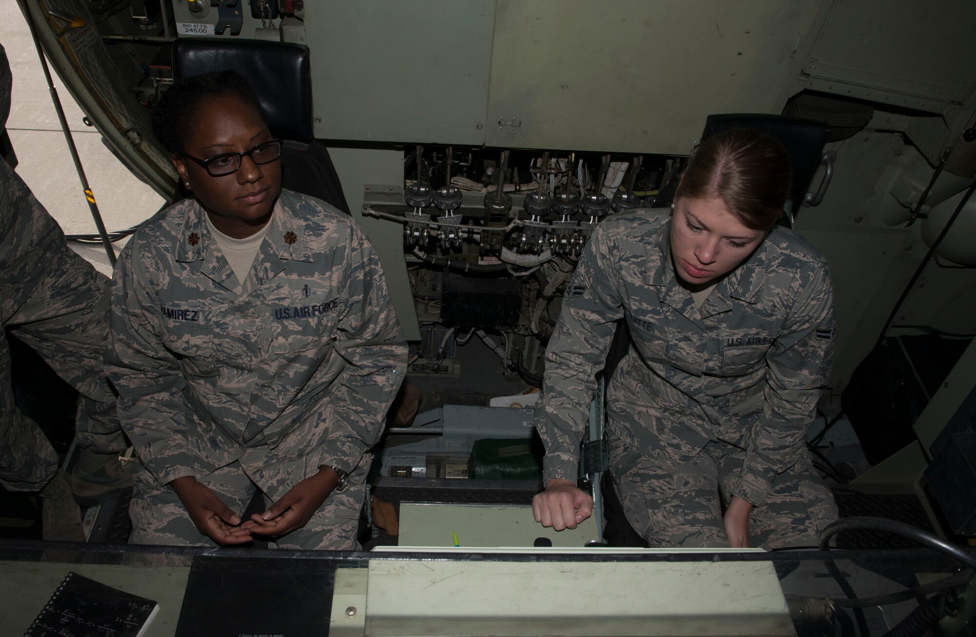 Maj. Venita Ramirez, 366th Aerospace Medicine Squadron public health flight commander, and Airman 1st Class Kiana Platte, 366th AMDS bioenvironmental engineering technicians, look at a control panel during a tour Sept. 19, 2016, at Mountain Home Air Force Base, Idaho. The C-130 is part of the 910th Air Wing stationed at Youngstown, Ohio. (U.S. Air Force photo by Senior Airman Malissa Lott/Released)